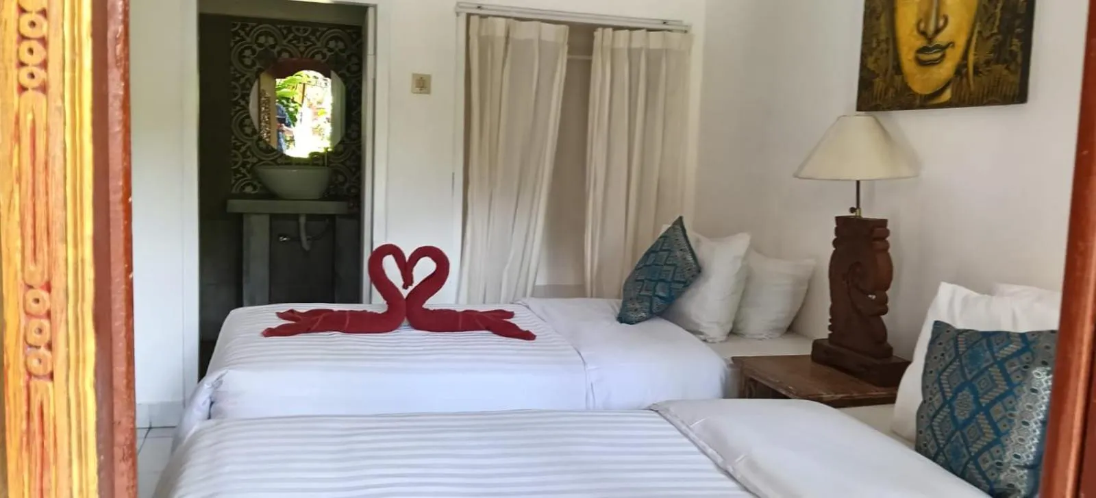 Bed in Puri Oka Beach Bungalows