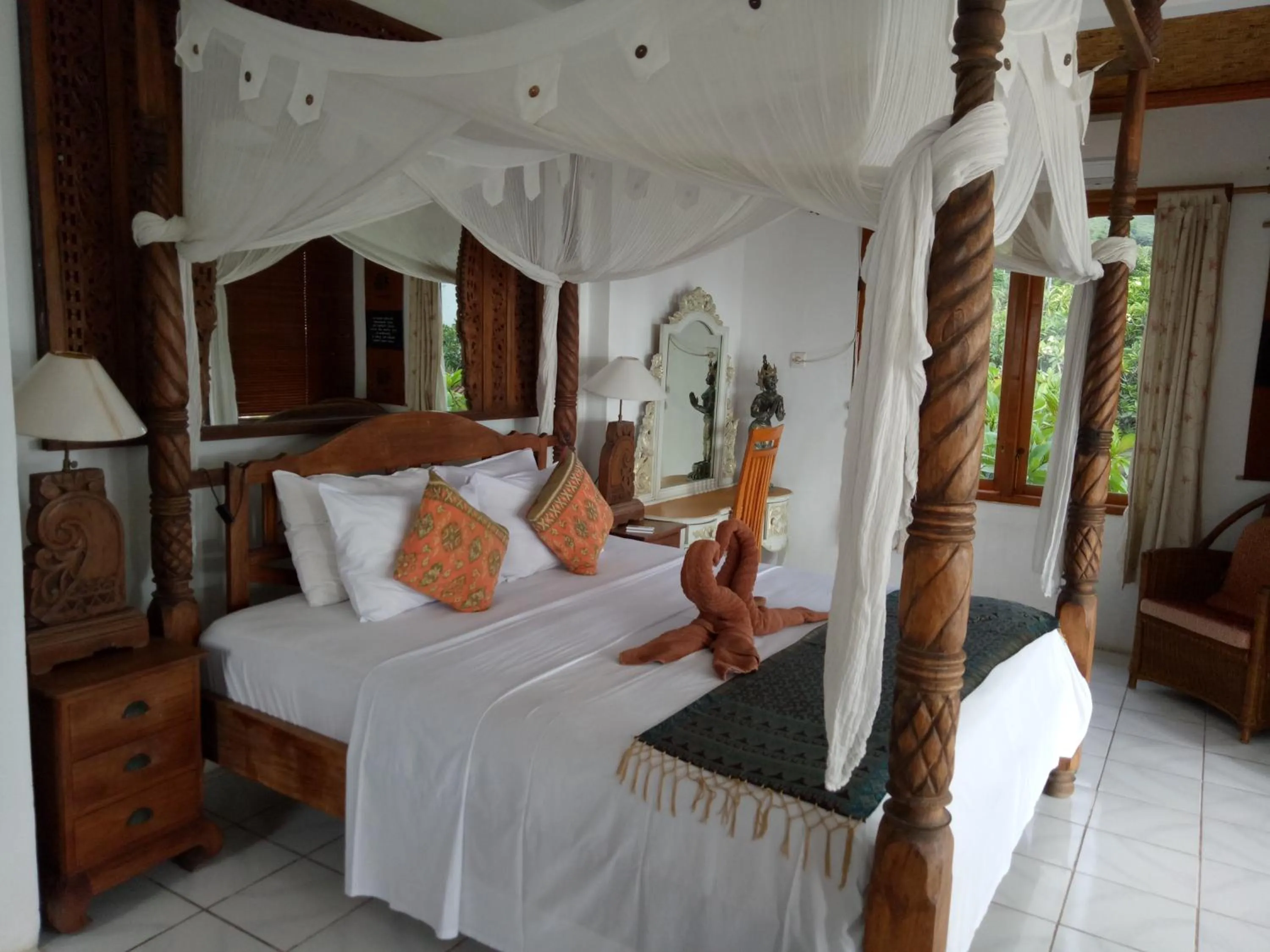 Bed in Puri Oka Beach Bungalows