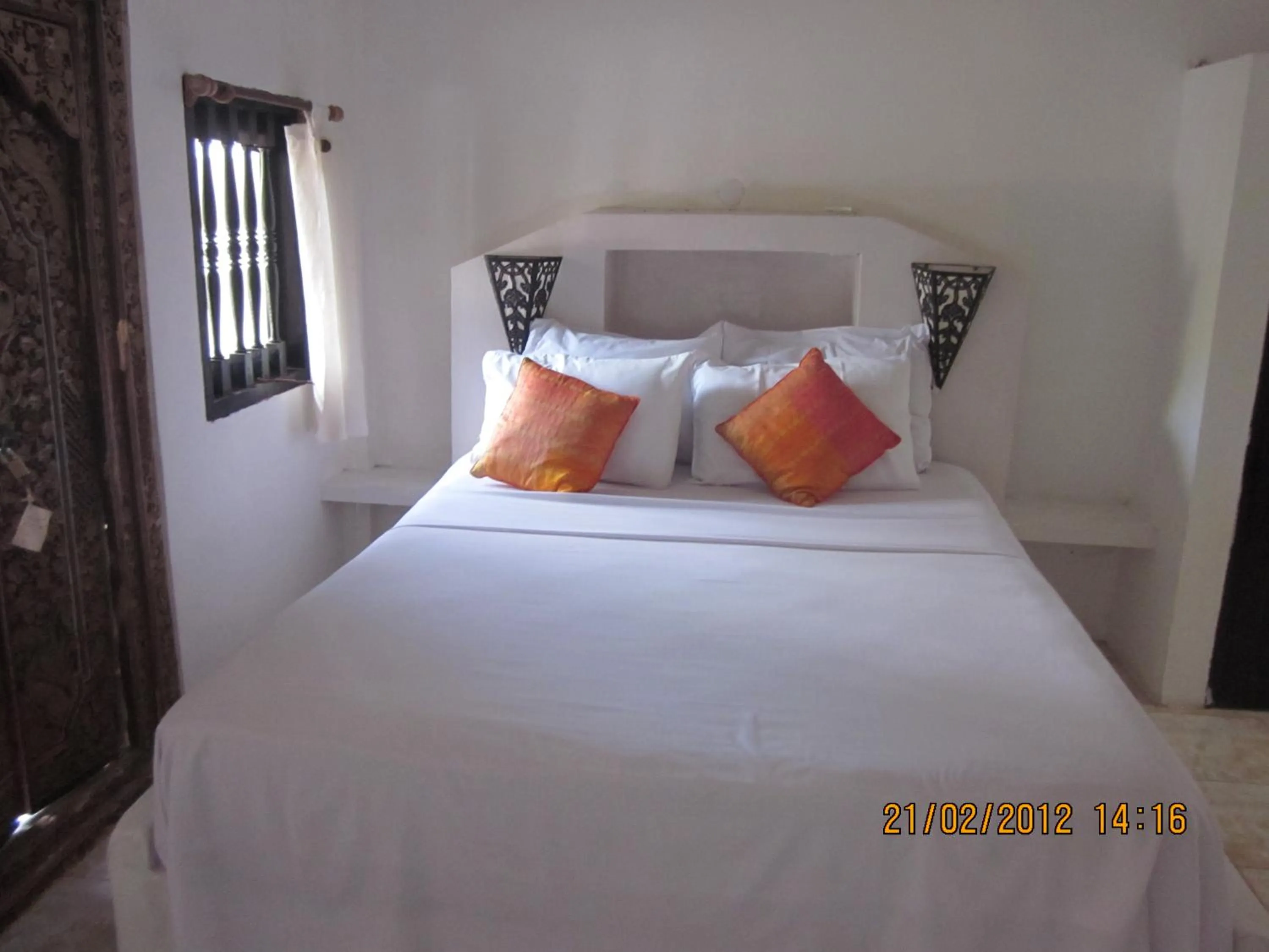 Bed in Puri Oka Beach Bungalows