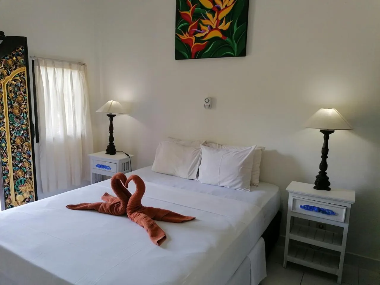 Bed in Puri Oka Beach Bungalows