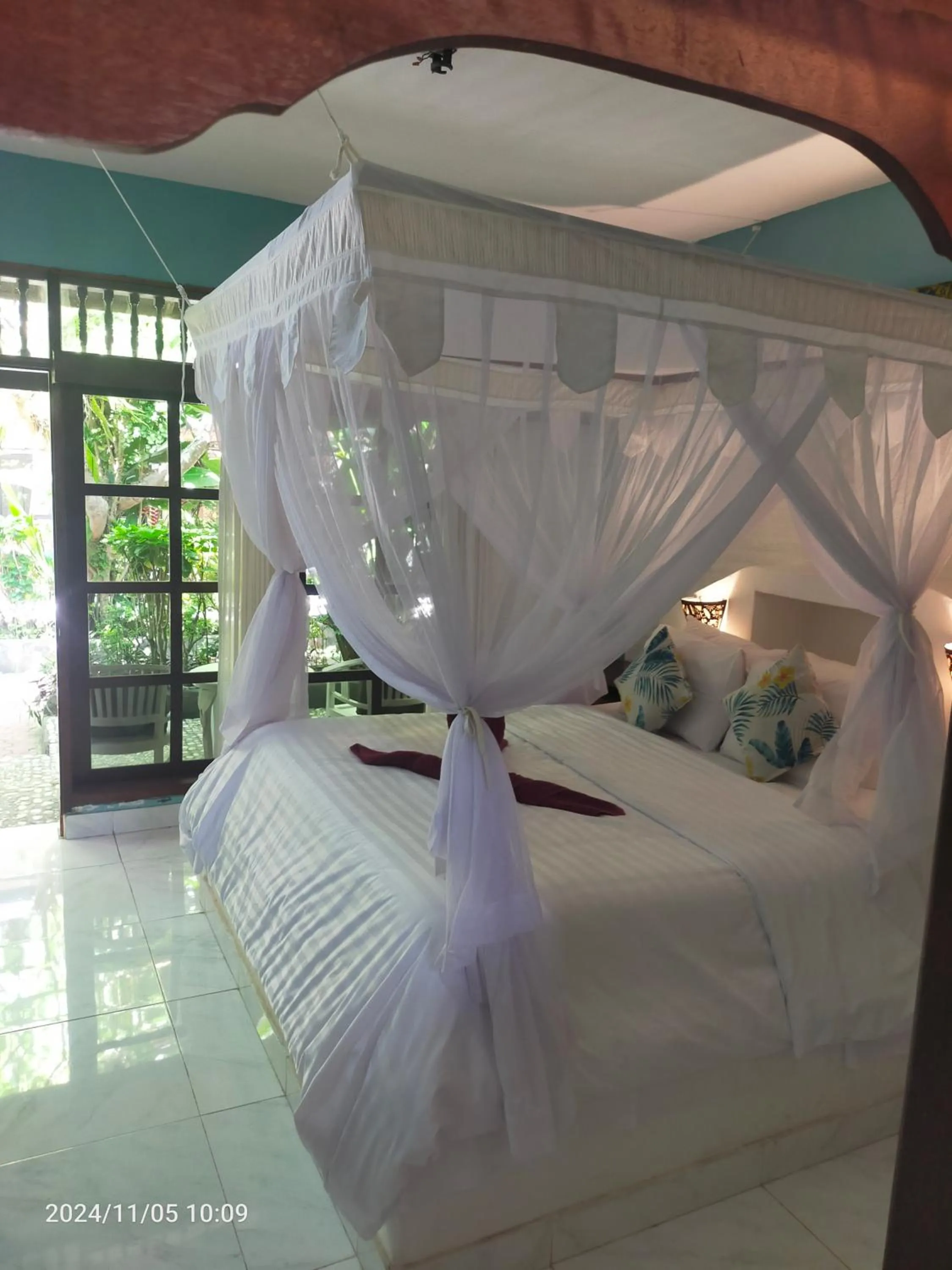 Bed in Puri Oka Beach Bungalows
