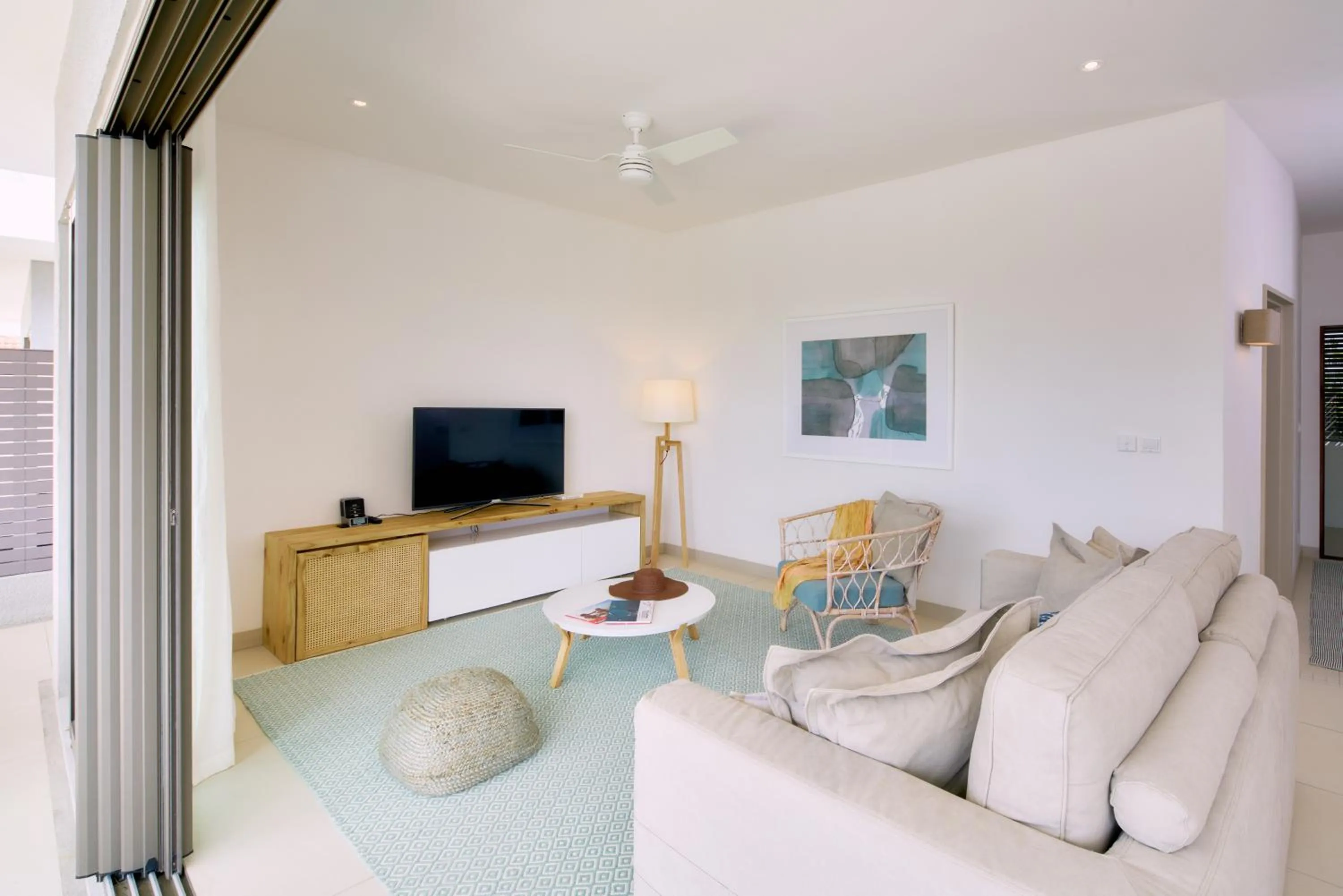 TV and multimedia in Les Estivales Beachfront Suites & Penthouses by LOV Mauritius