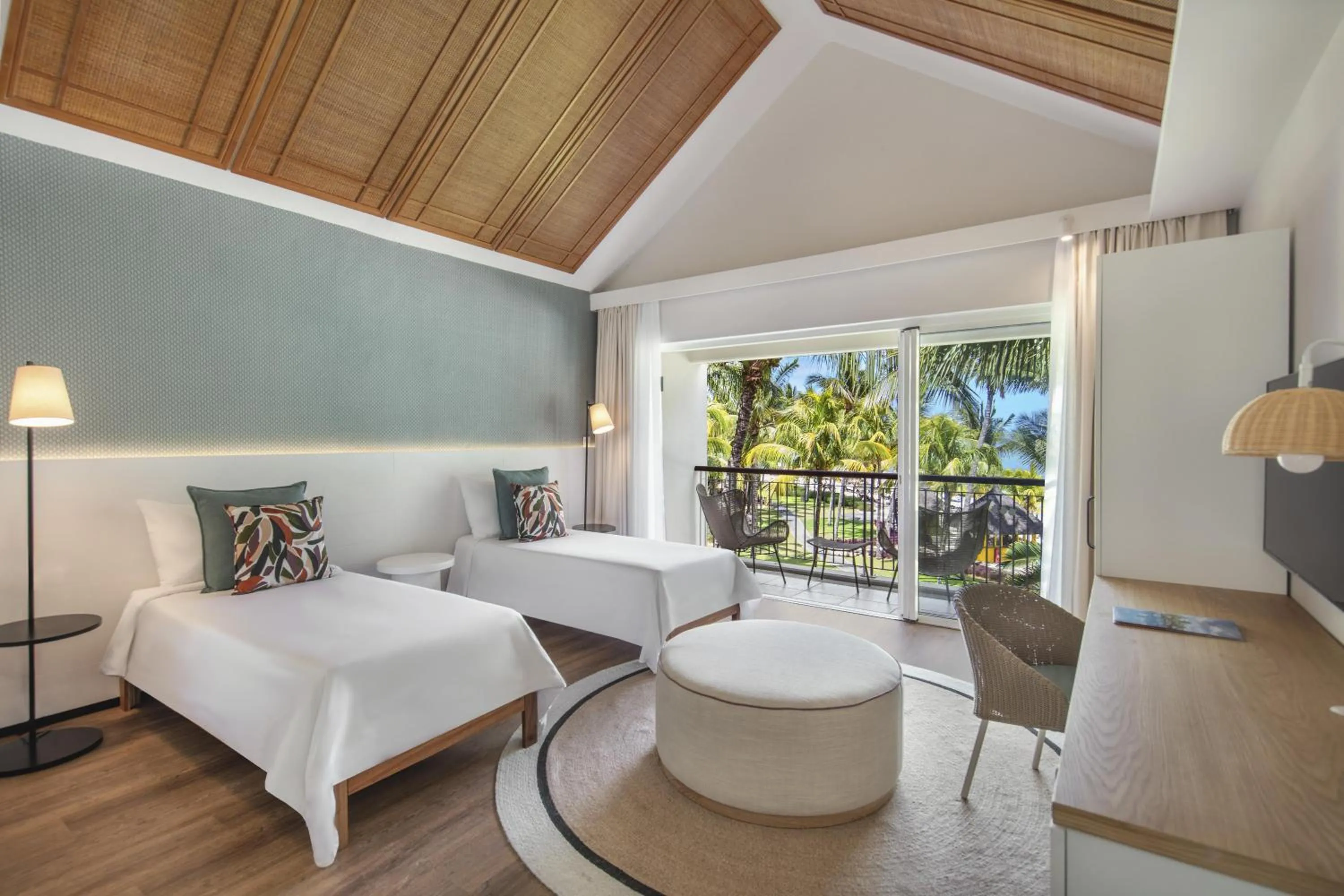 Bed in Victoria Beachcomber Resort & Spa