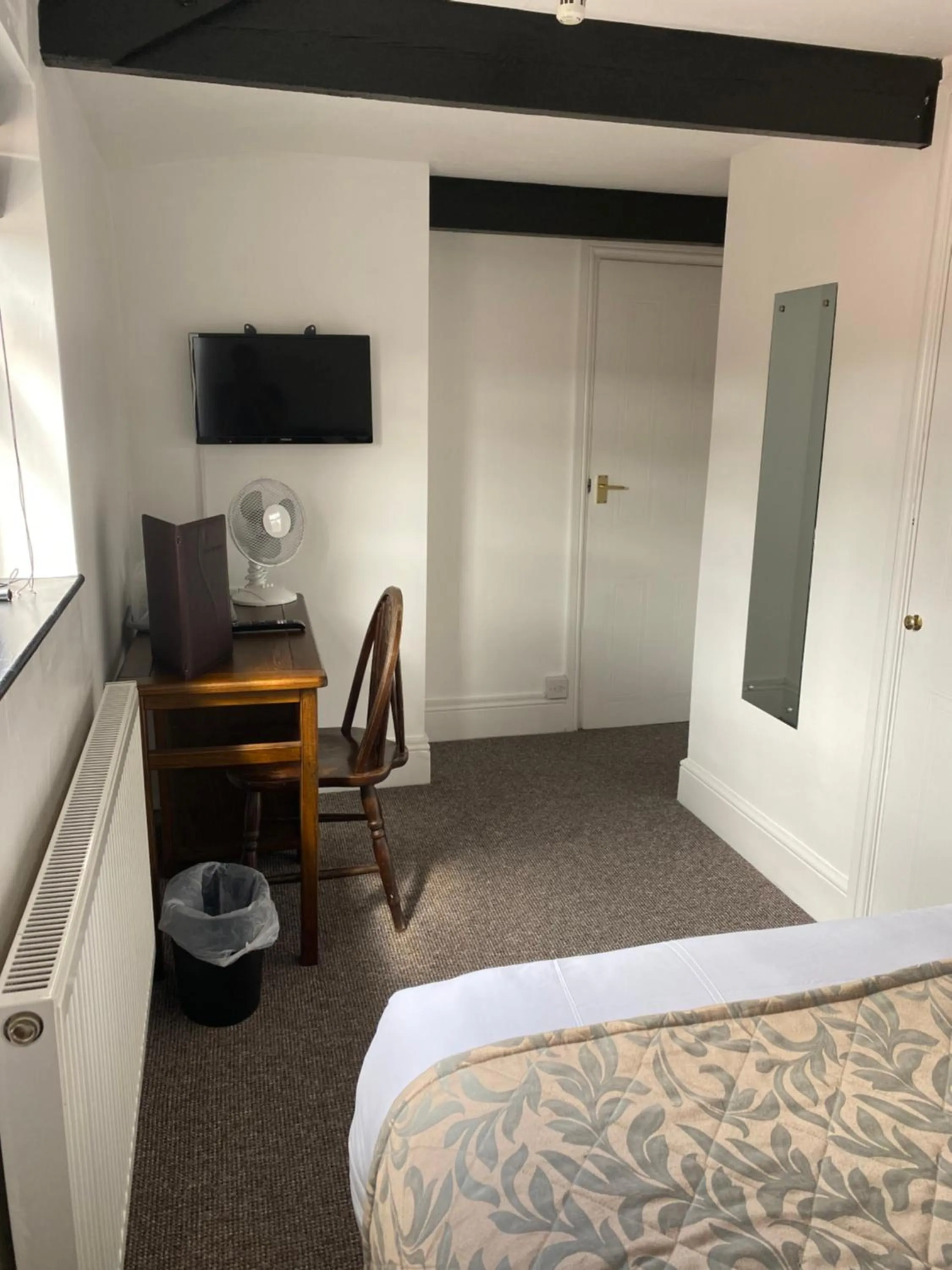 Bed in The Tudor Hotel