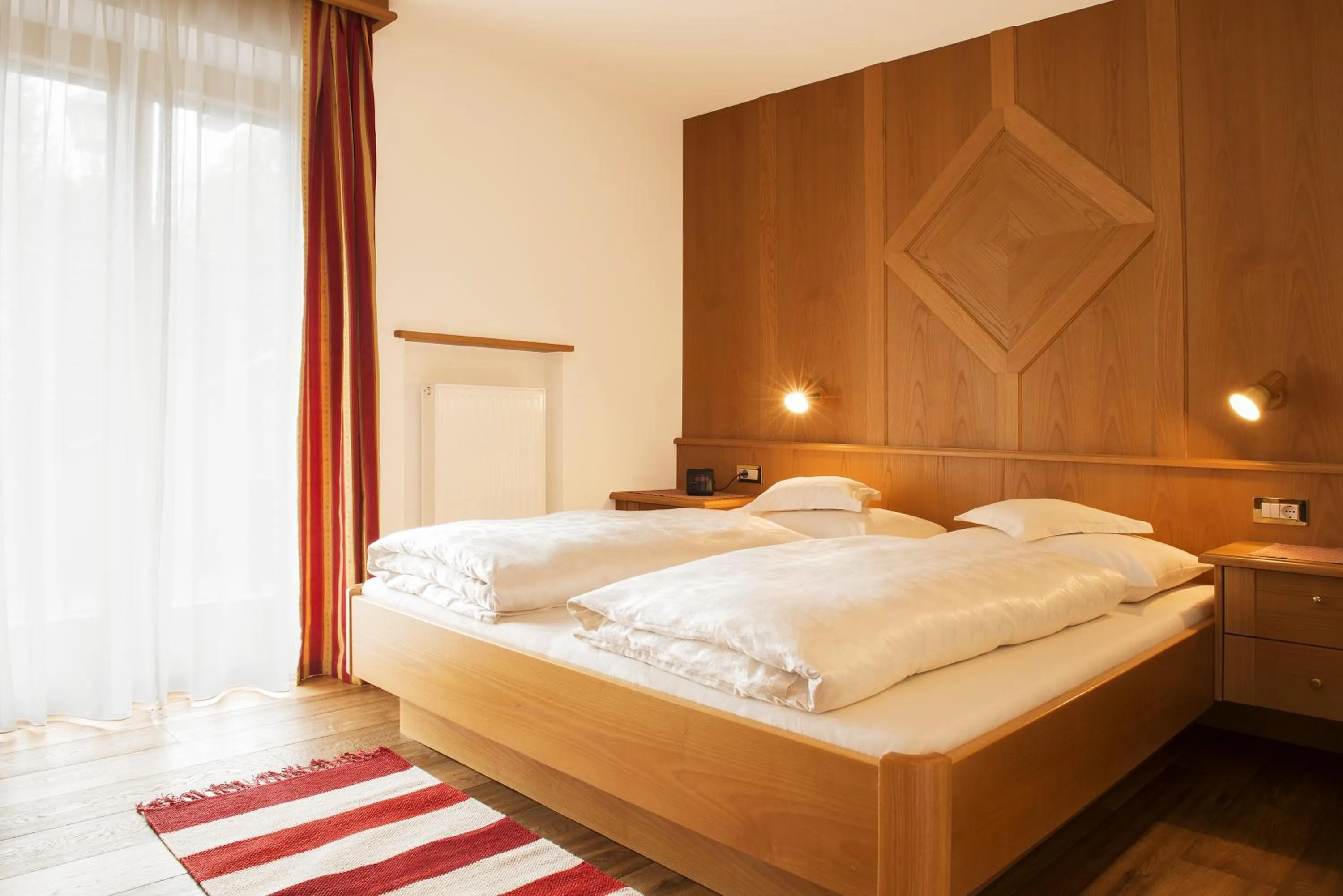 Bed in Garni Hotel Geier