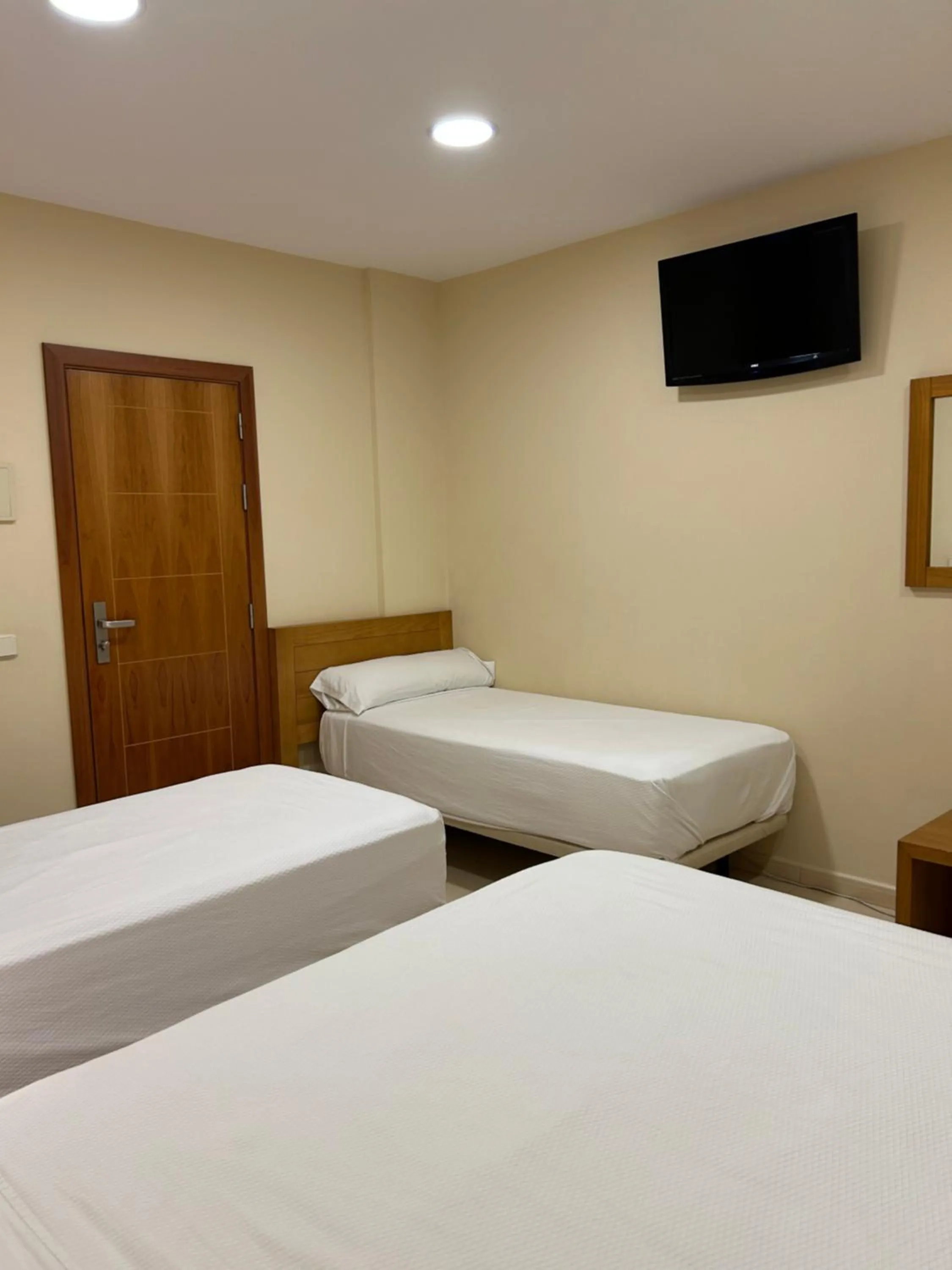 Bed in Hostal Aeropuerto