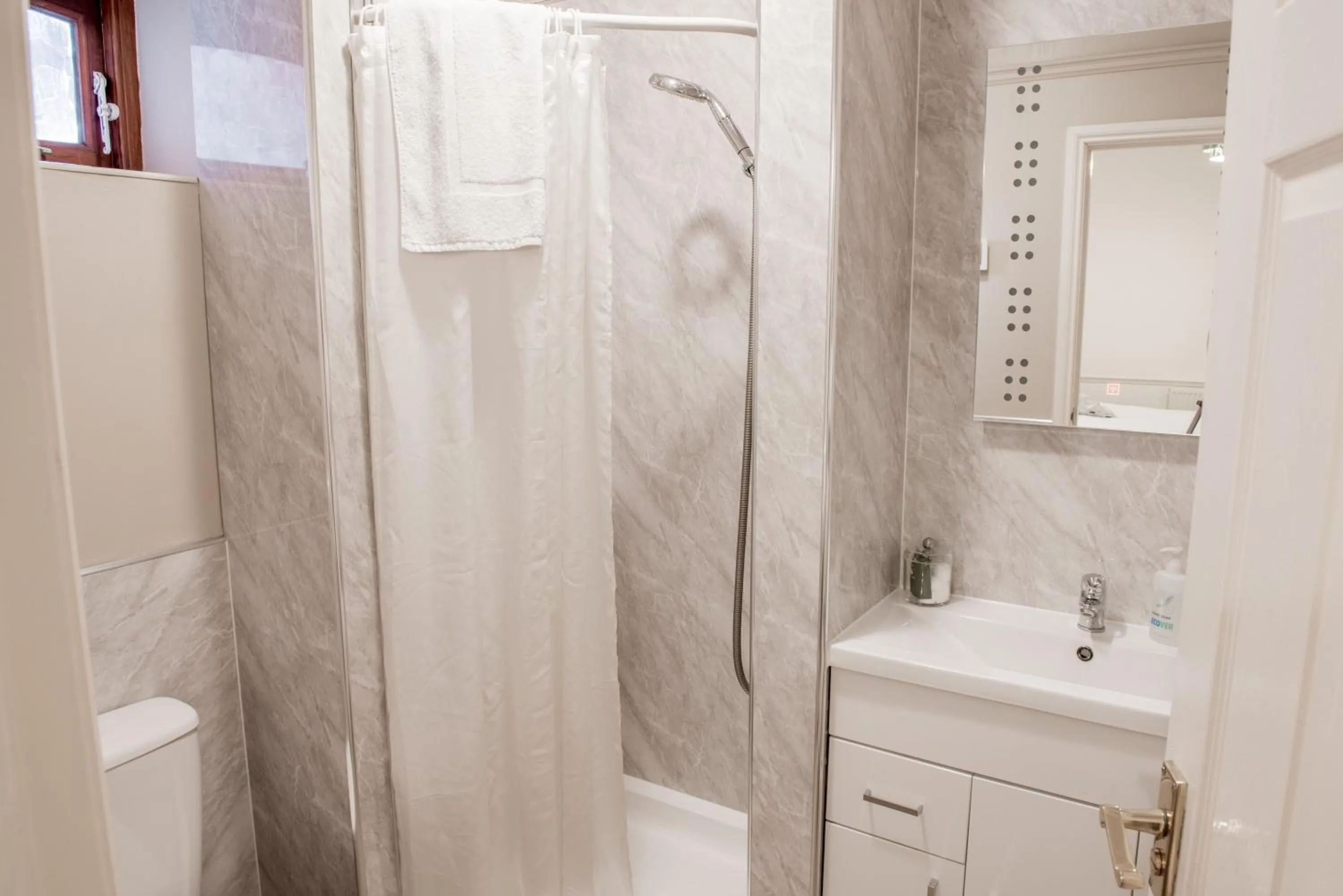 Shower in Toothbrush Rooms at Lattice Lodge - Guest Kitchen & EV Recharging