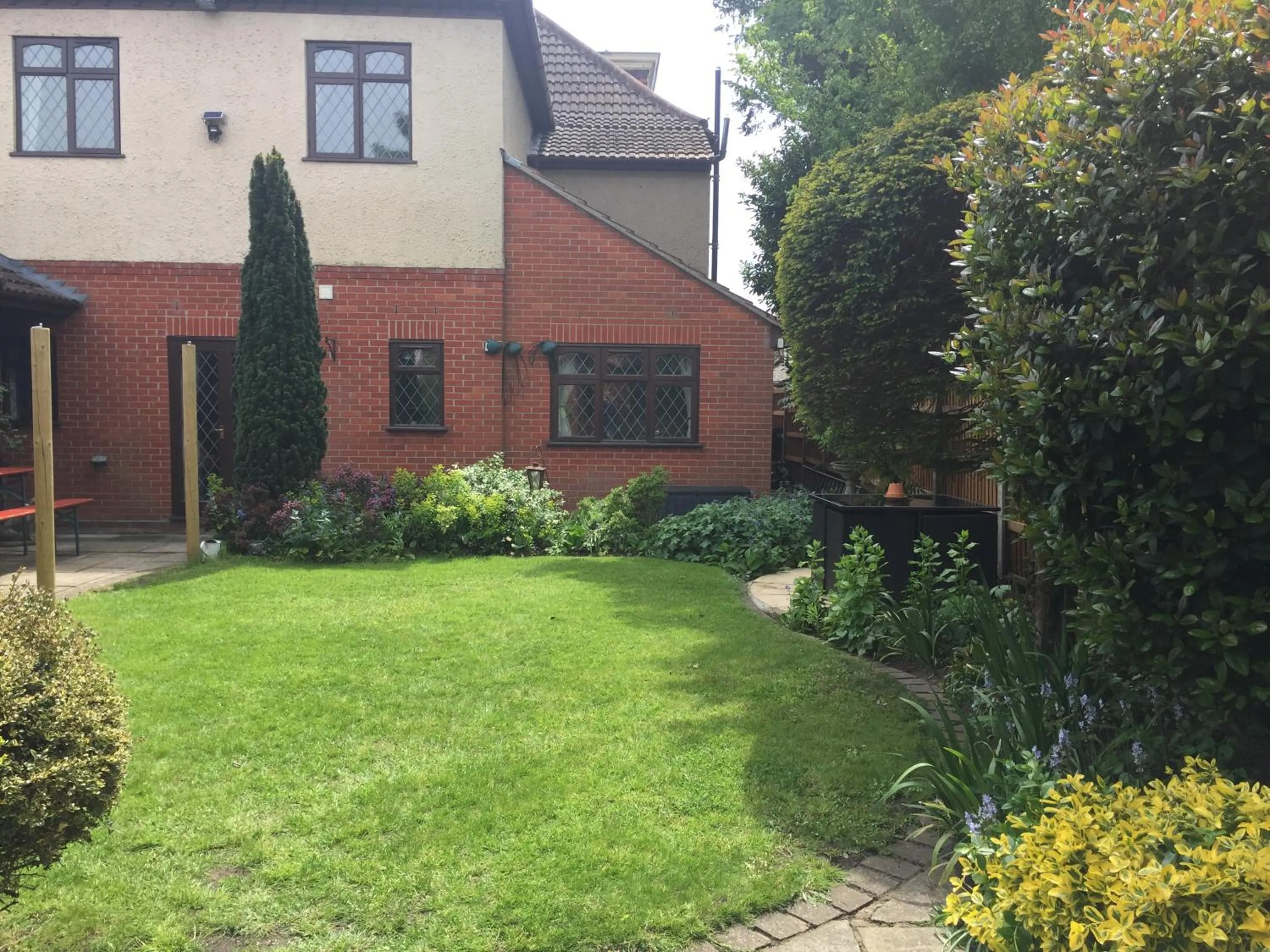 Garden in Toothbrush Rooms at Lattice Lodge - Guest Kitchen & EV Recharging