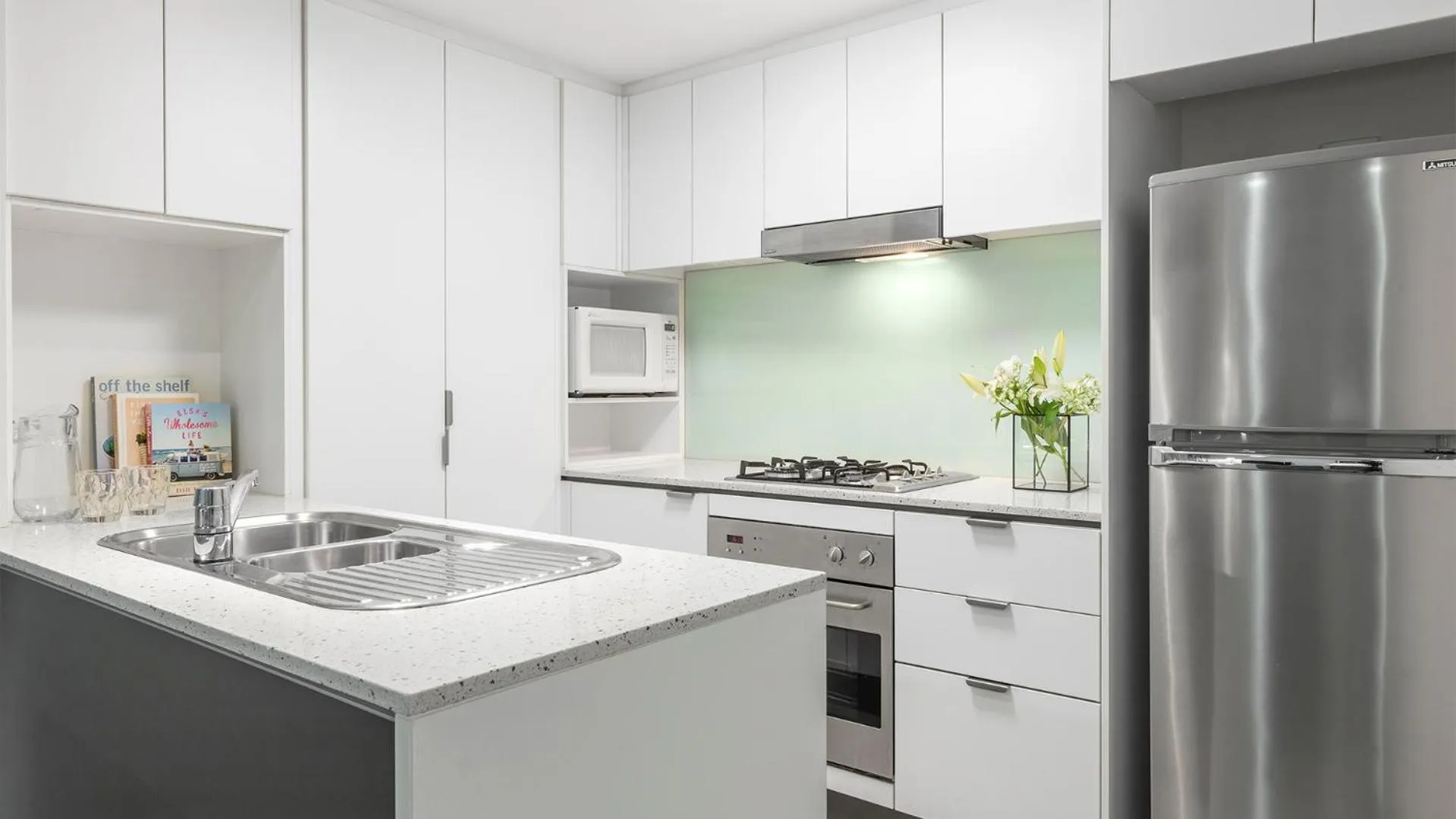 Kitchen or kitchenette in Oaks Brisbane Festival Suites