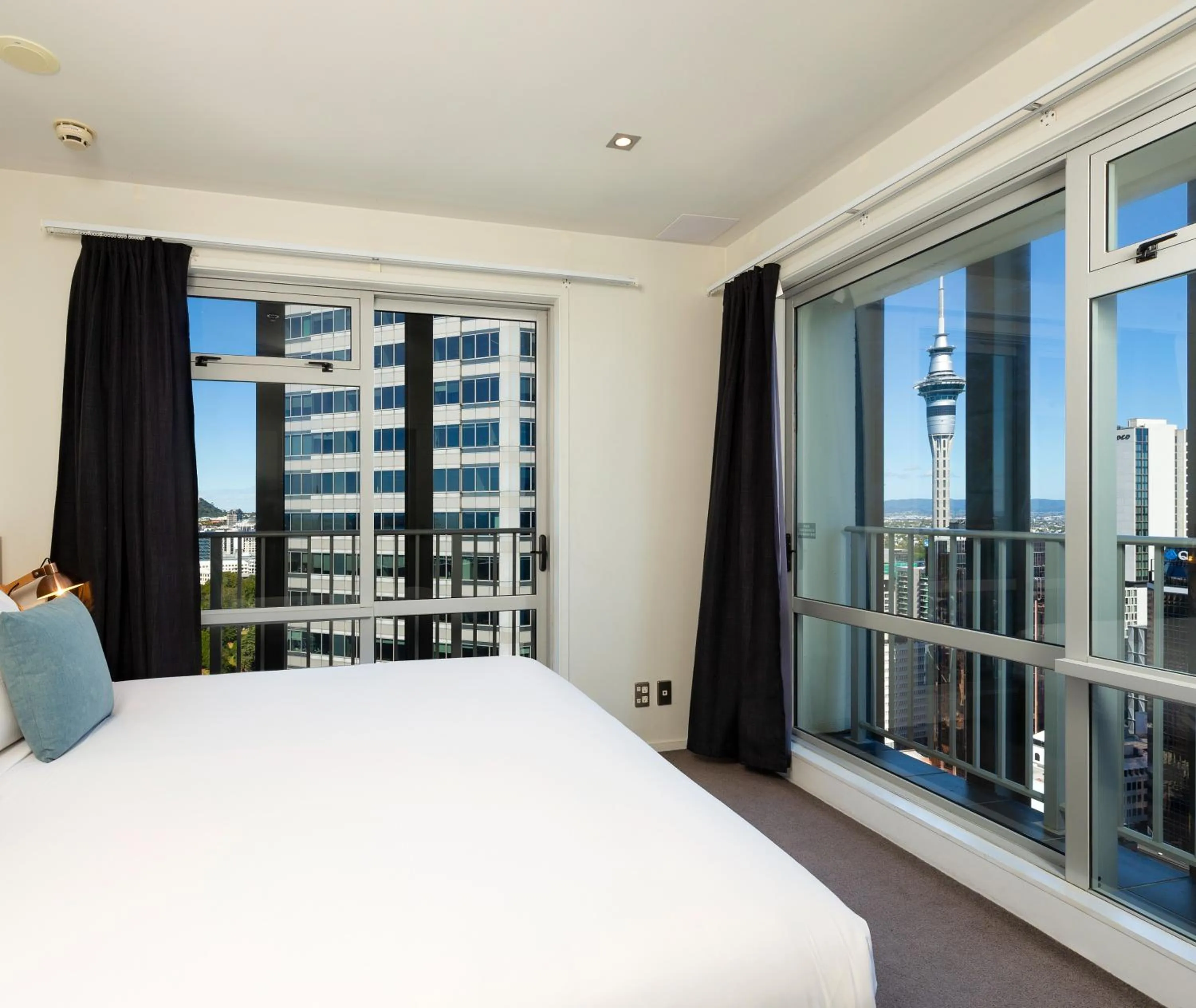 Bed in Auckland Harbour Suites