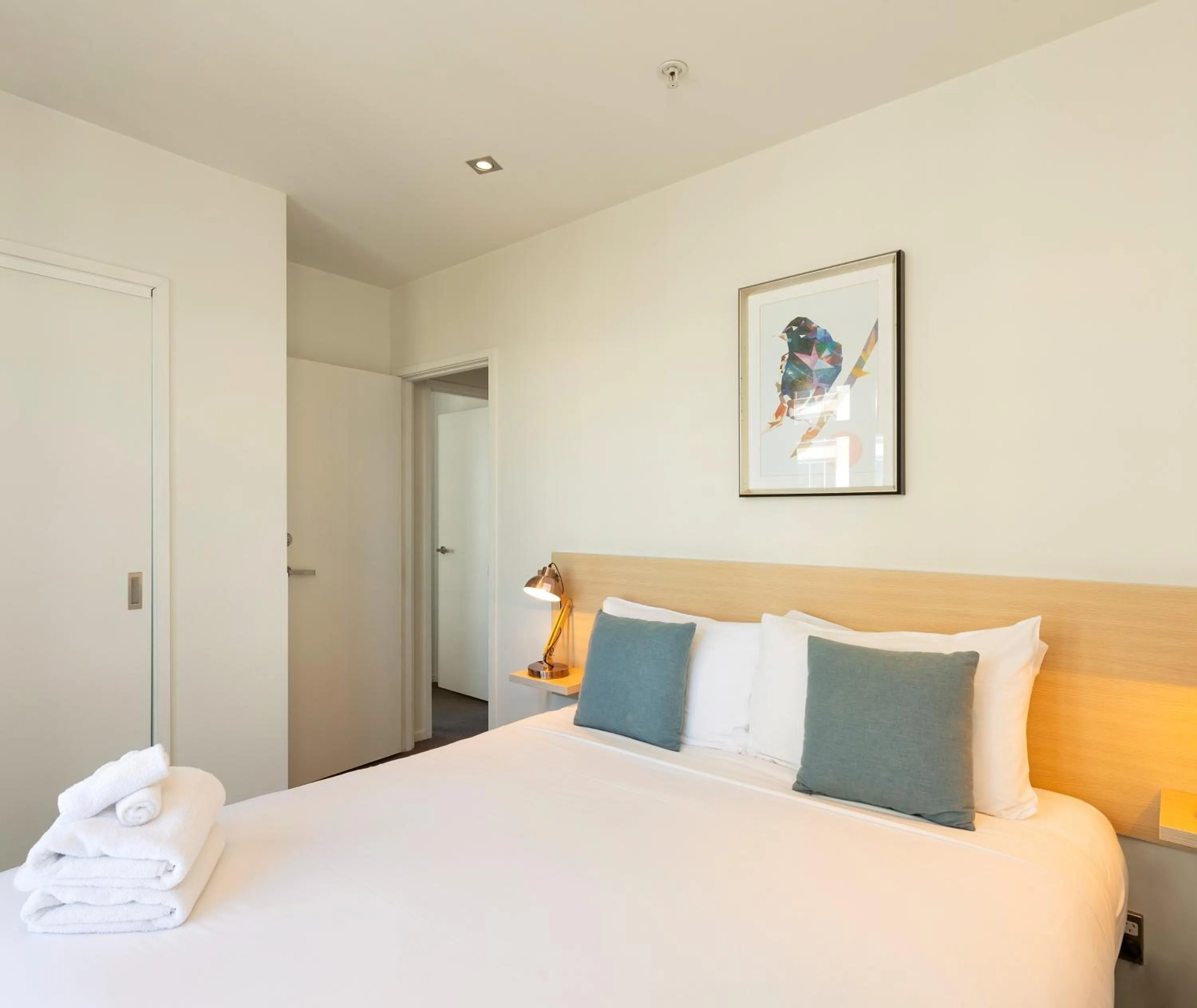 Bed in Auckland Harbour Suites