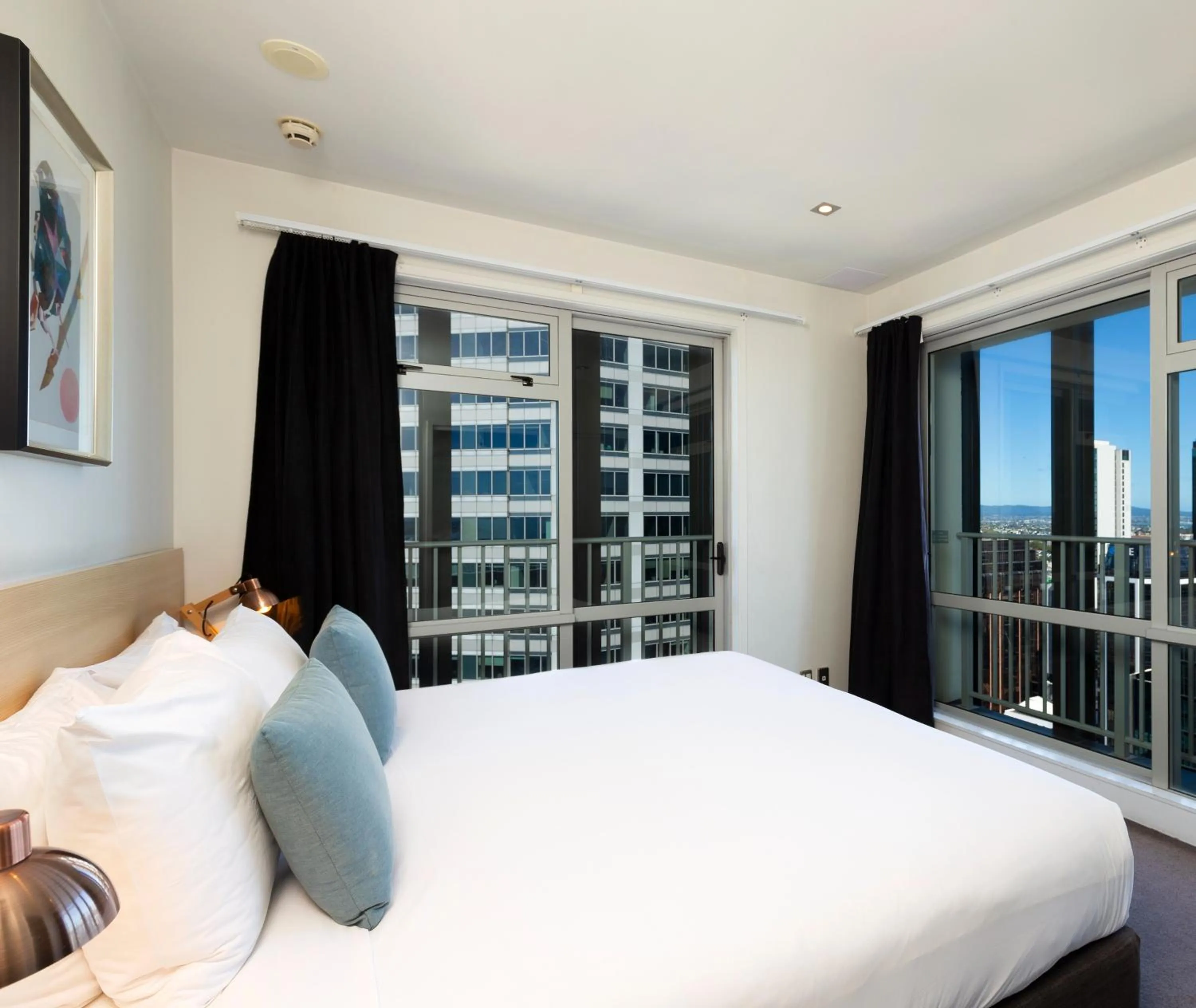 Bed in Auckland Harbour Suites