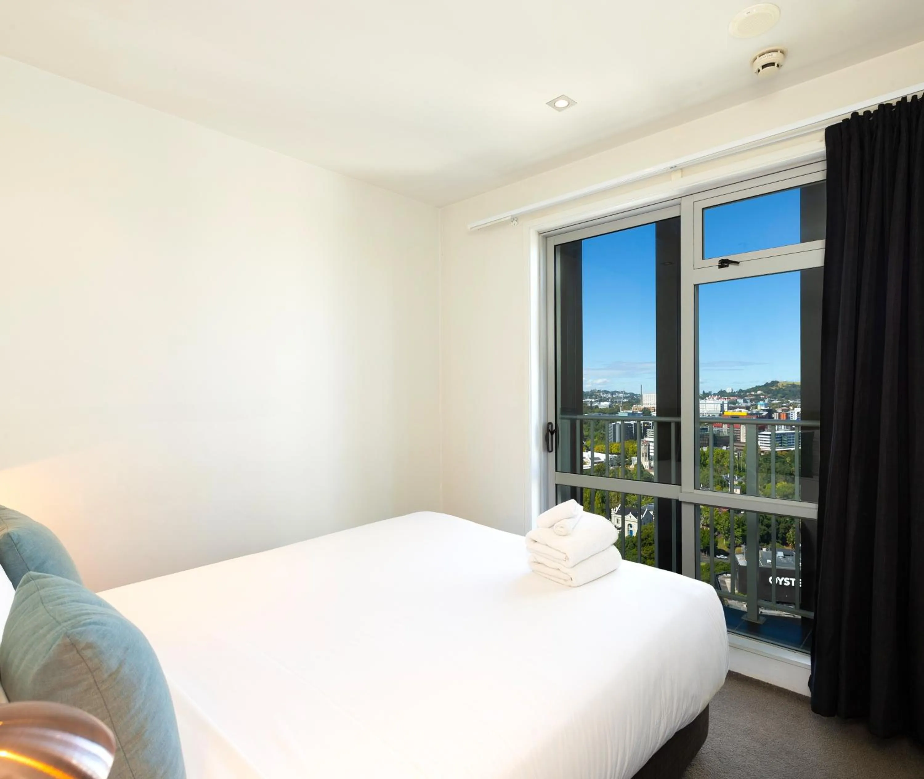 Bed in Auckland Harbour Suites