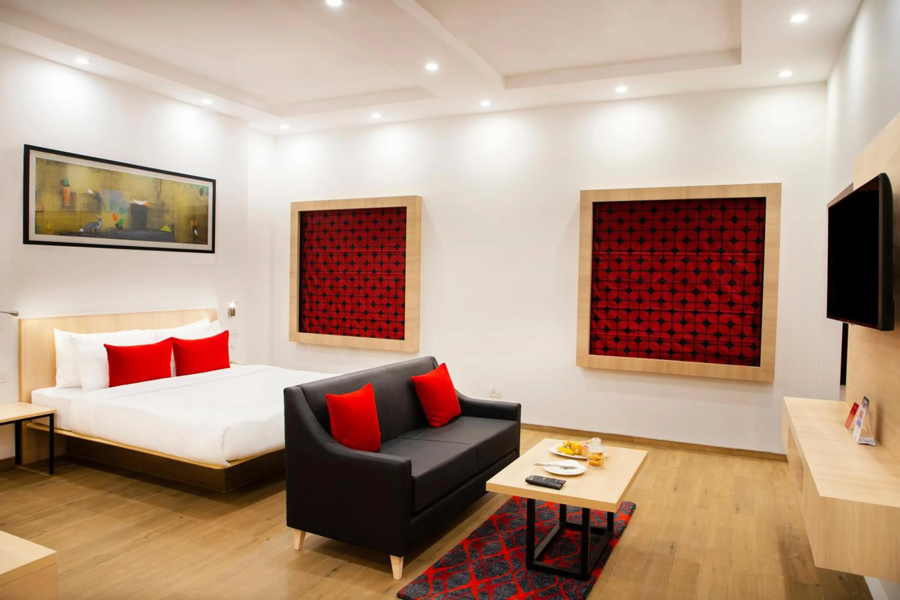 Seating area, Bed in Red Fox by Lemon Tree Hotels, Dehradun