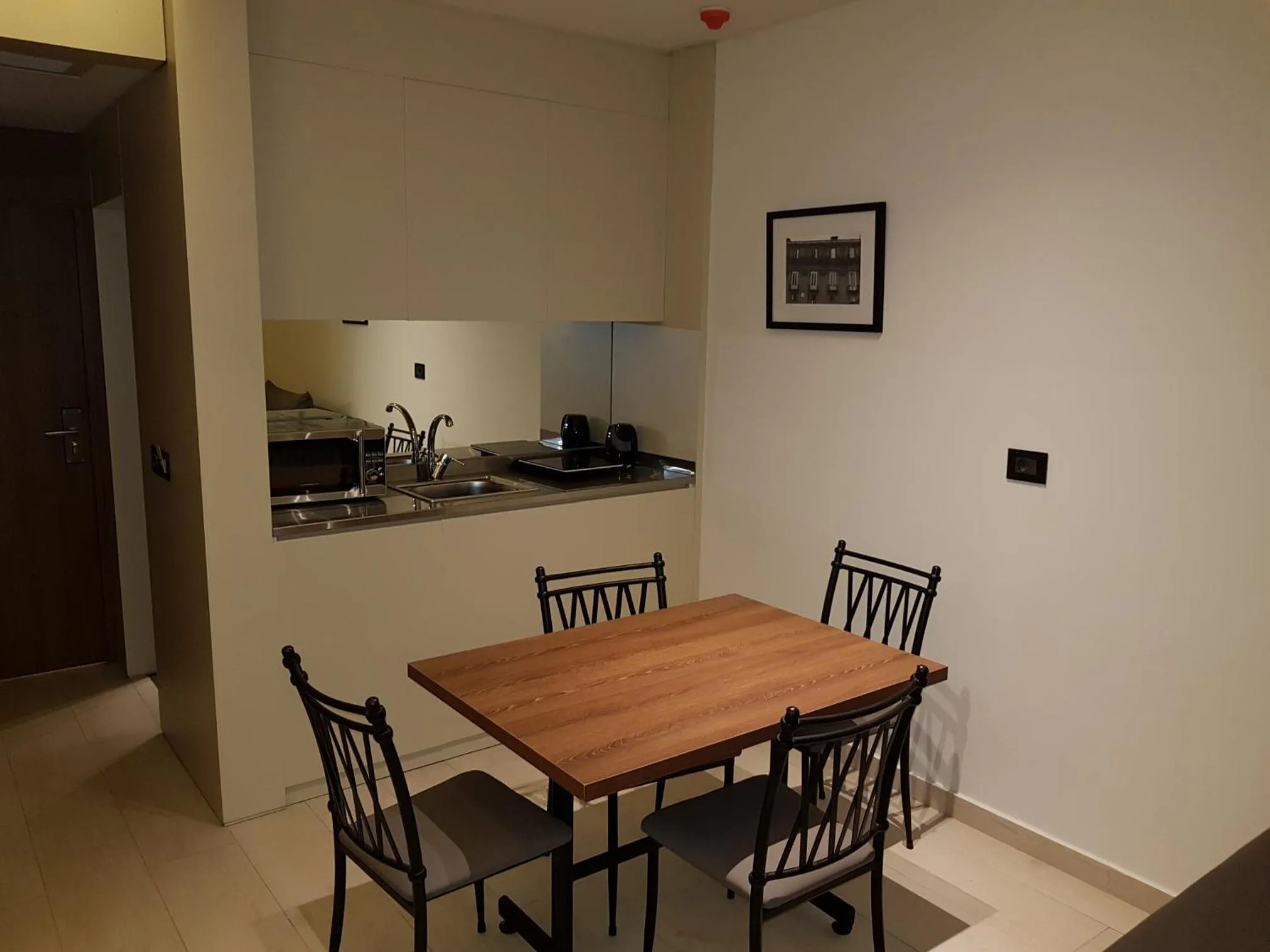 Kitchen or kitchenette in Le Pave Hotel