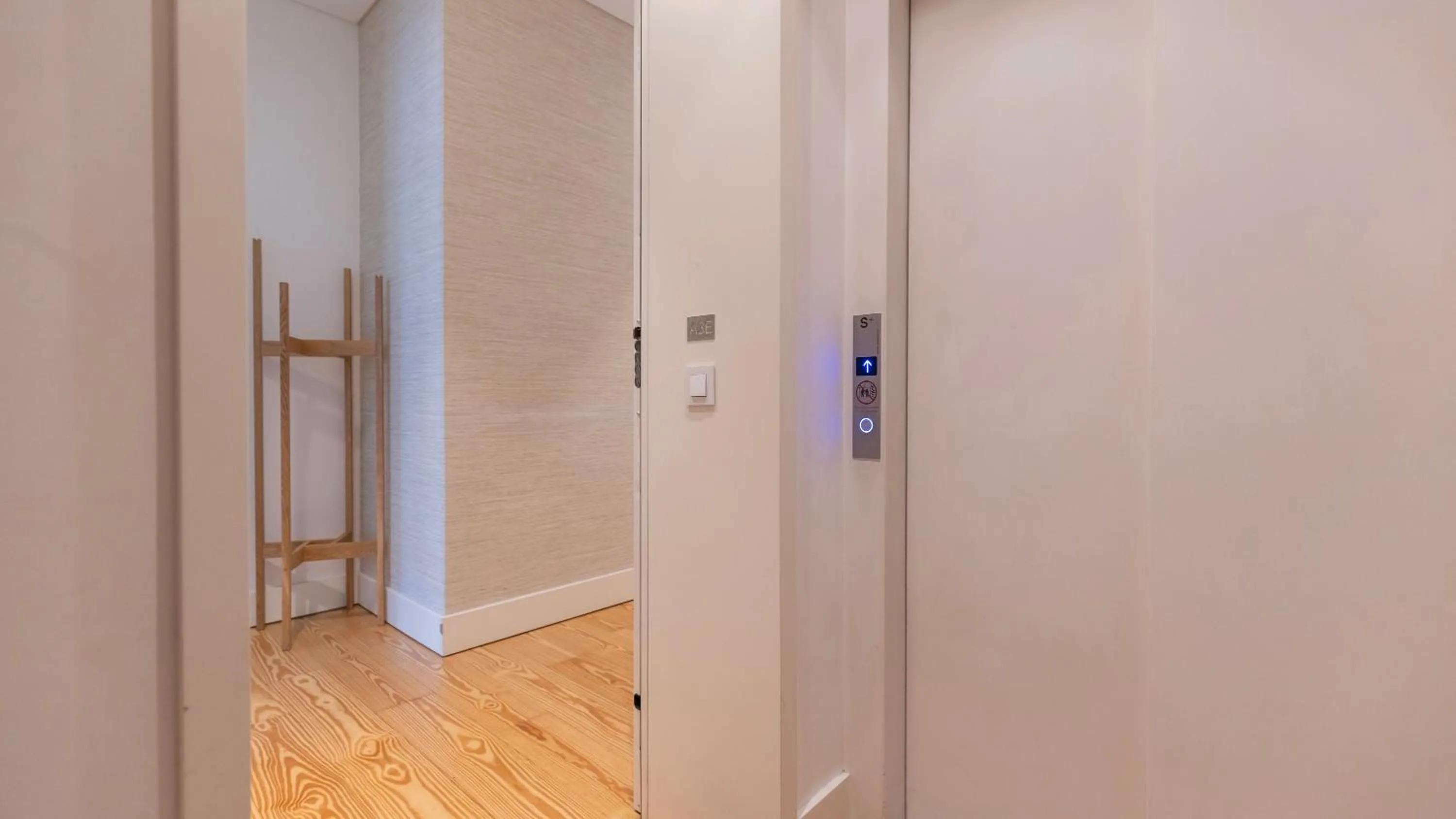 elevator in Downtown by the River Apartment by LovelyStay
