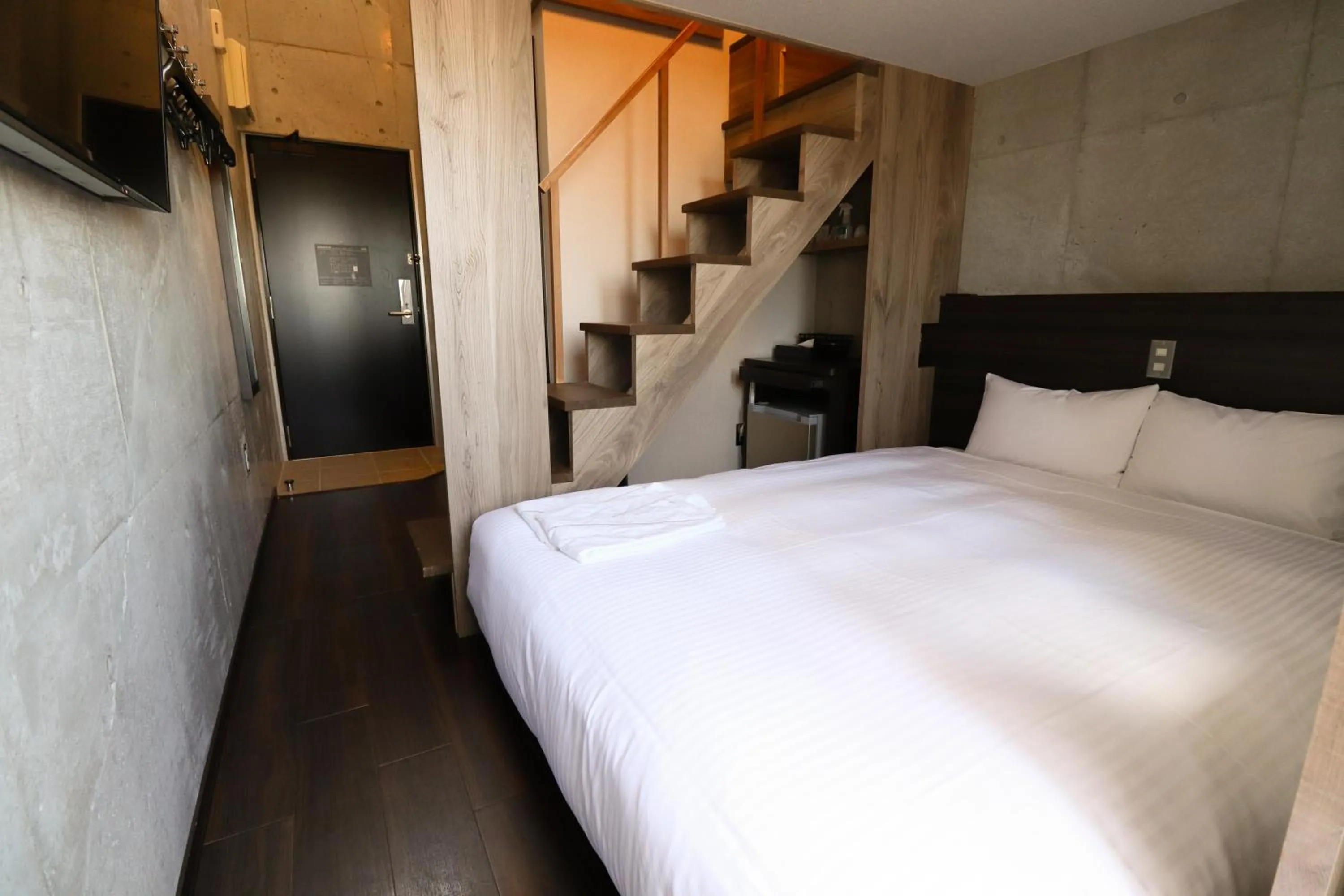 Photo of the whole room, Bed in The BREAKFAST HOTEL MARCHE Ishigaki Island