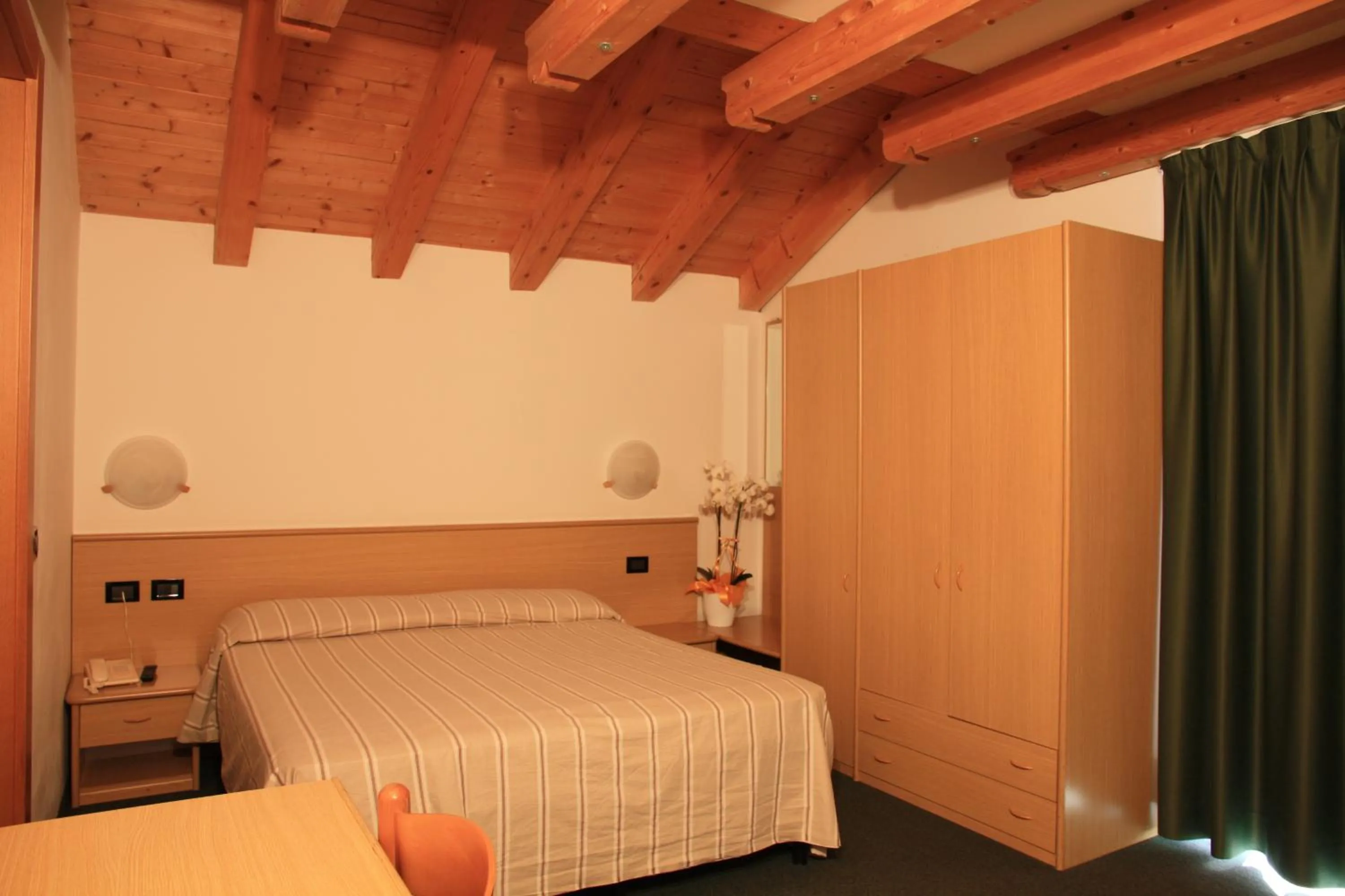 Bed in Albergo Miramonti