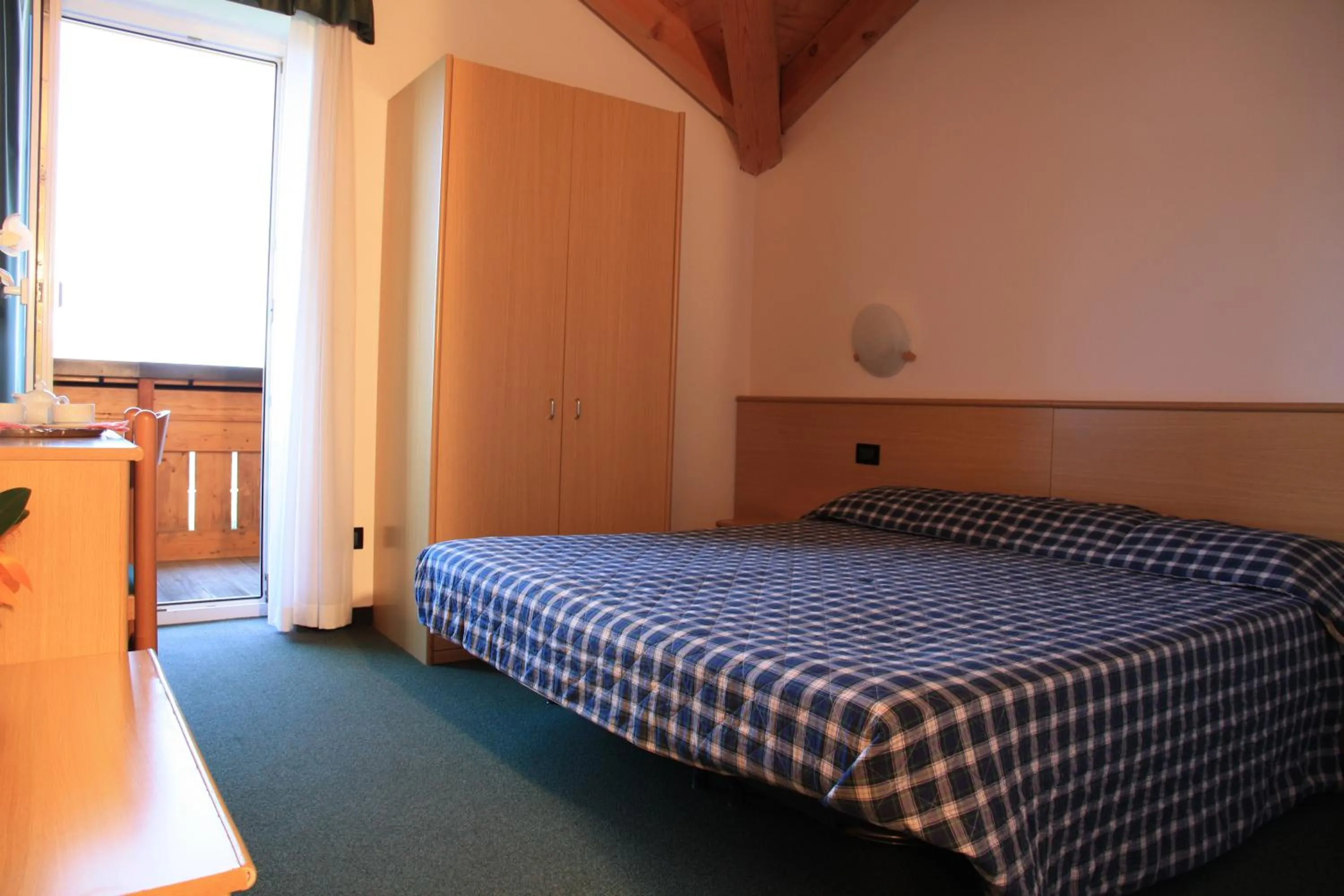Bed in Albergo Miramonti