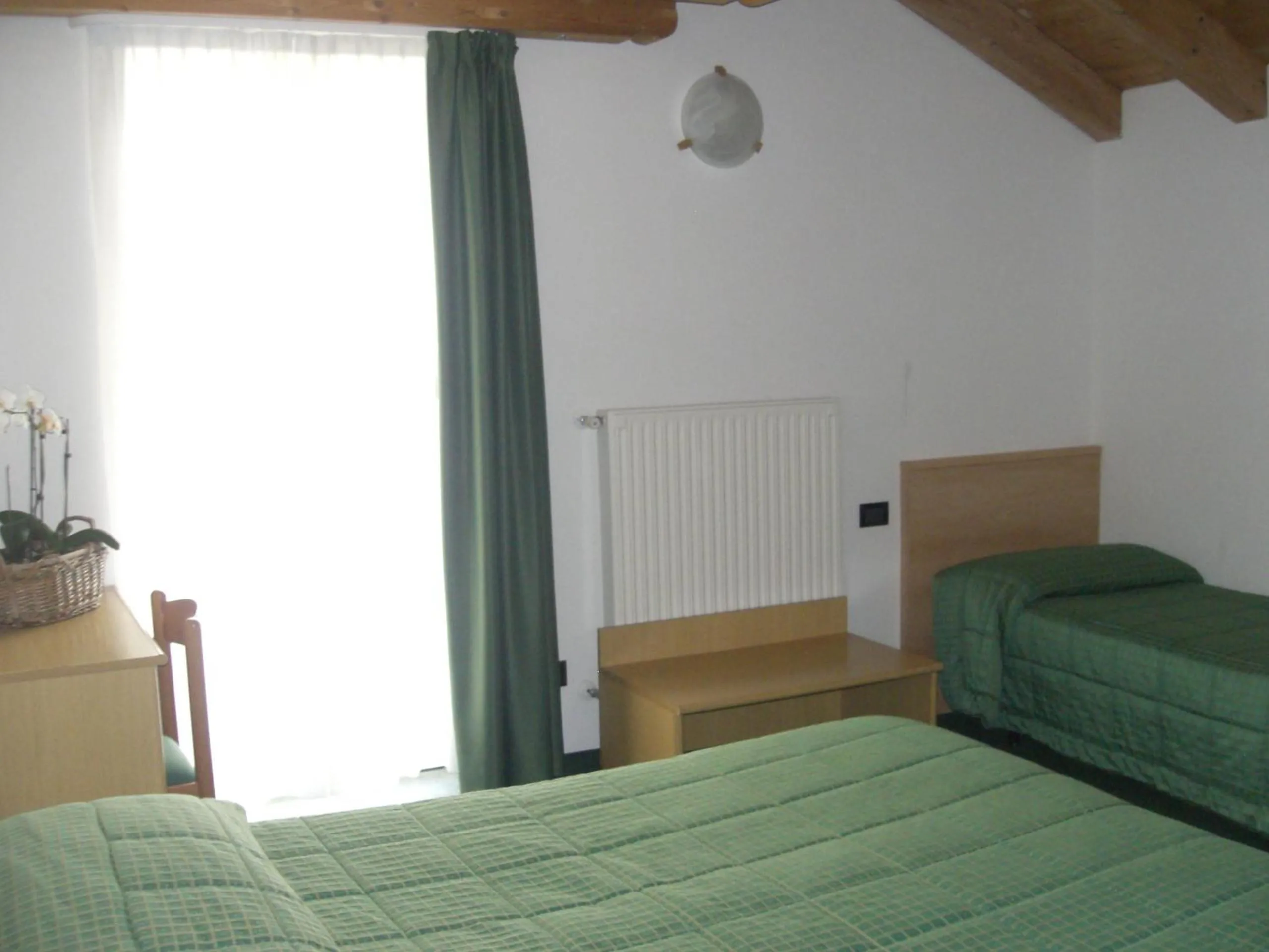 Bed in Albergo Miramonti