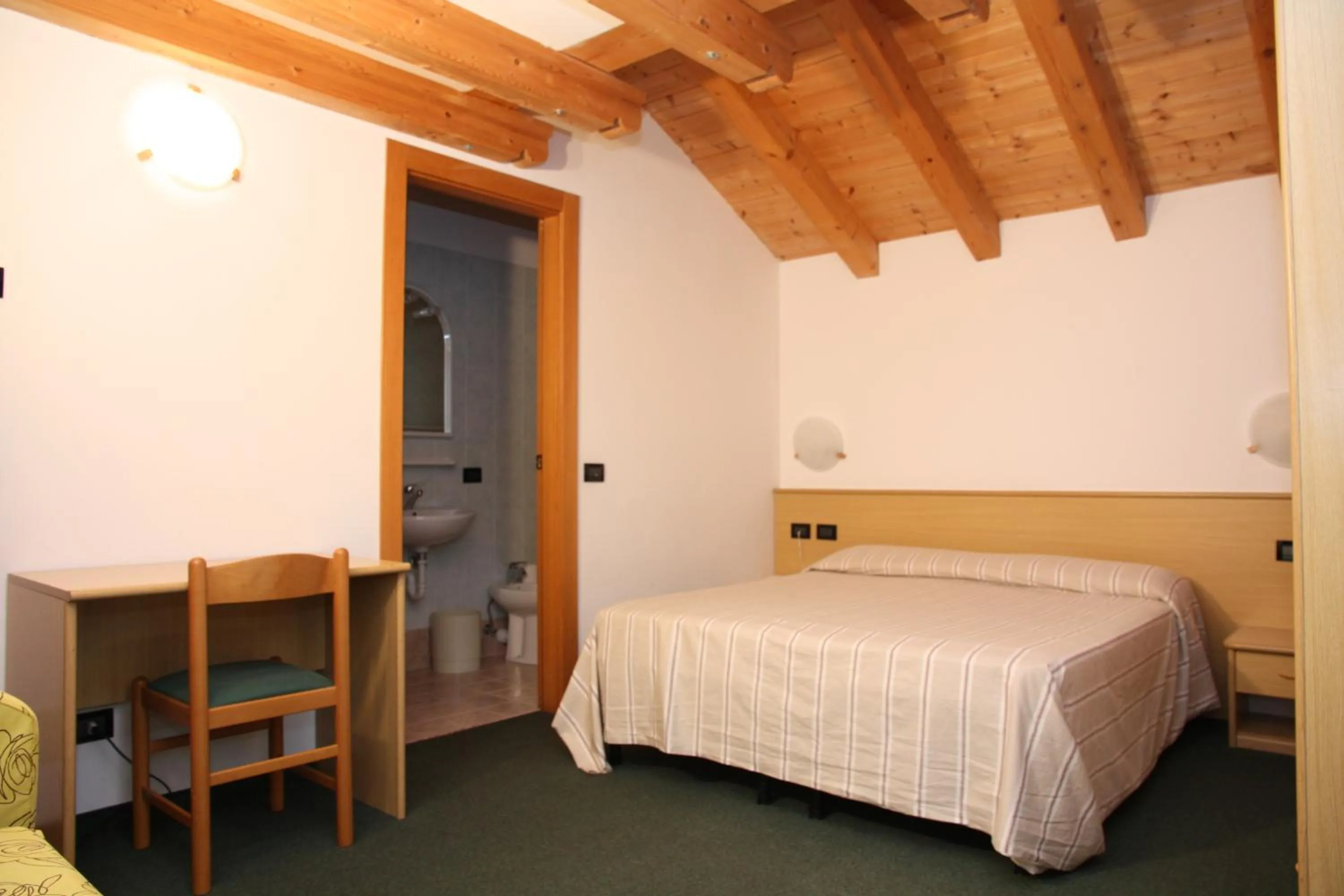 Bed in Albergo Miramonti