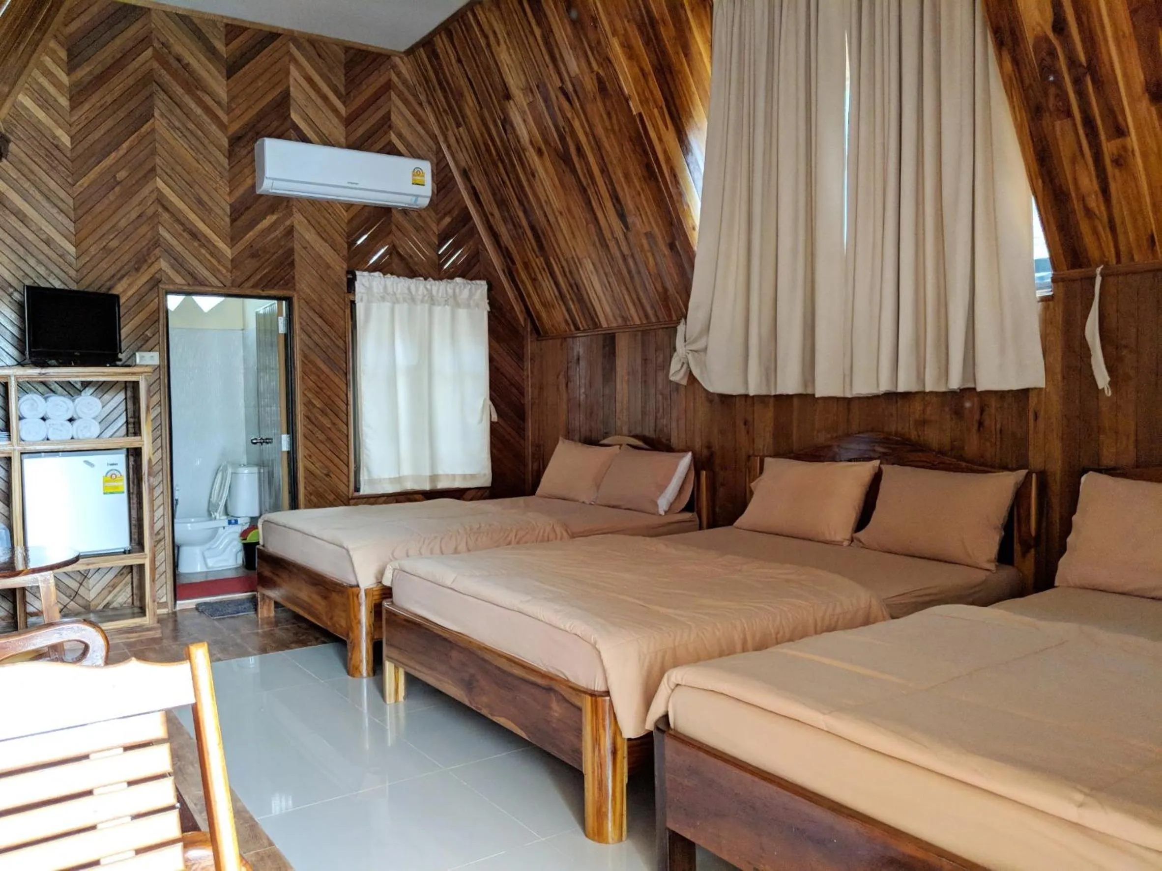 Bed in Bansuanphuhong Resort