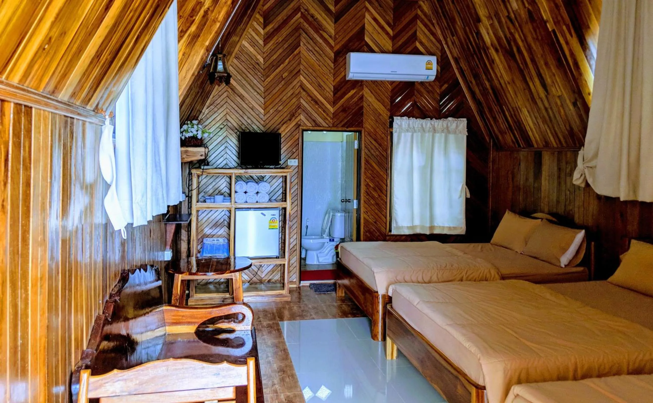 Bed in Bansuanphuhong Resort