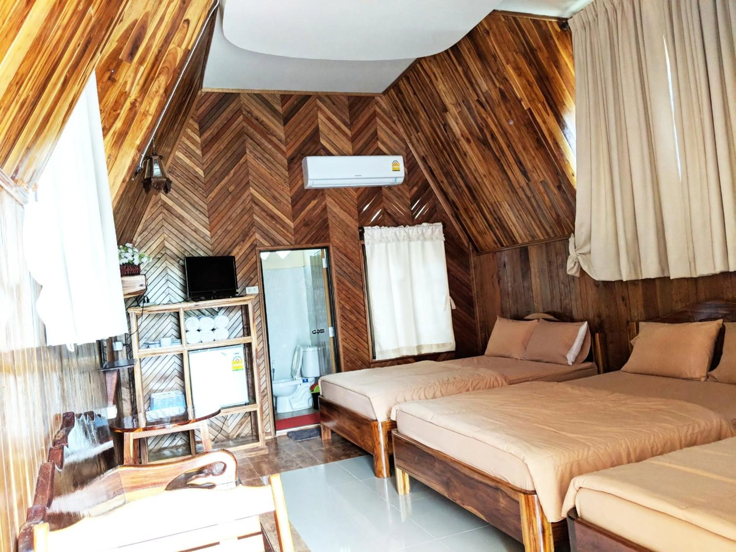 Bed in Bansuanphuhong Resort