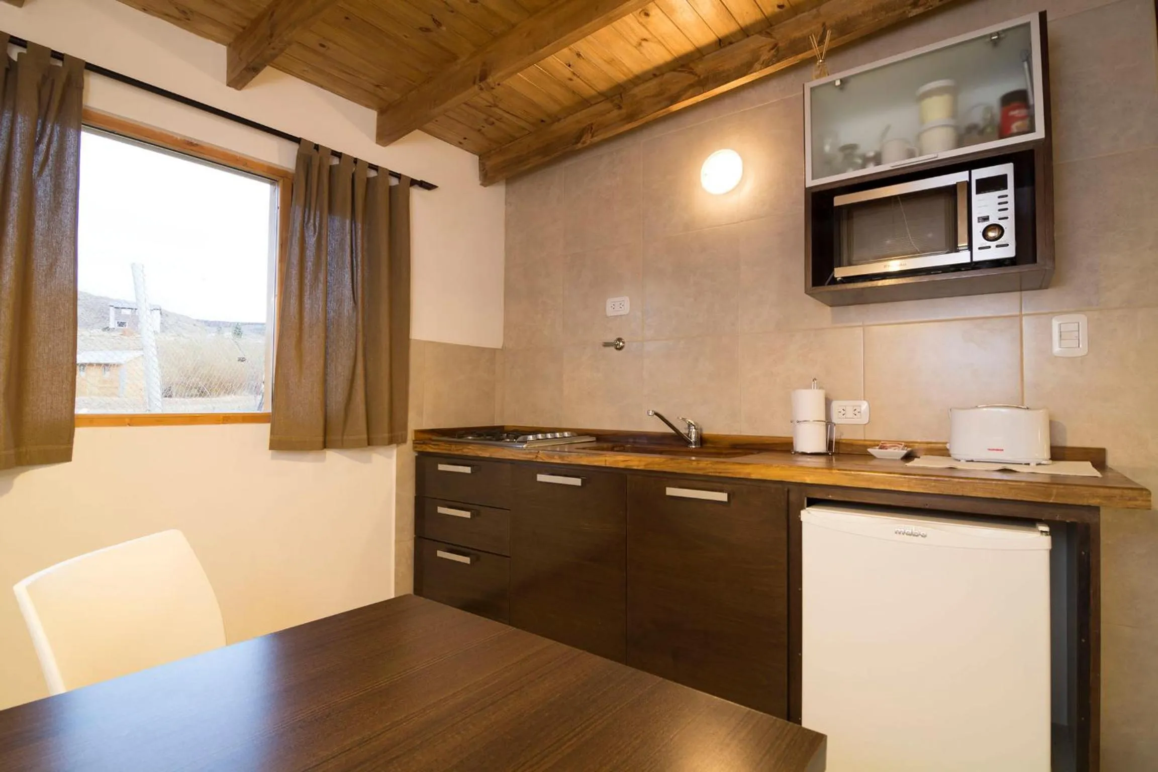 Kitchen or kitchenette in Posada y Cabañas El Barranco