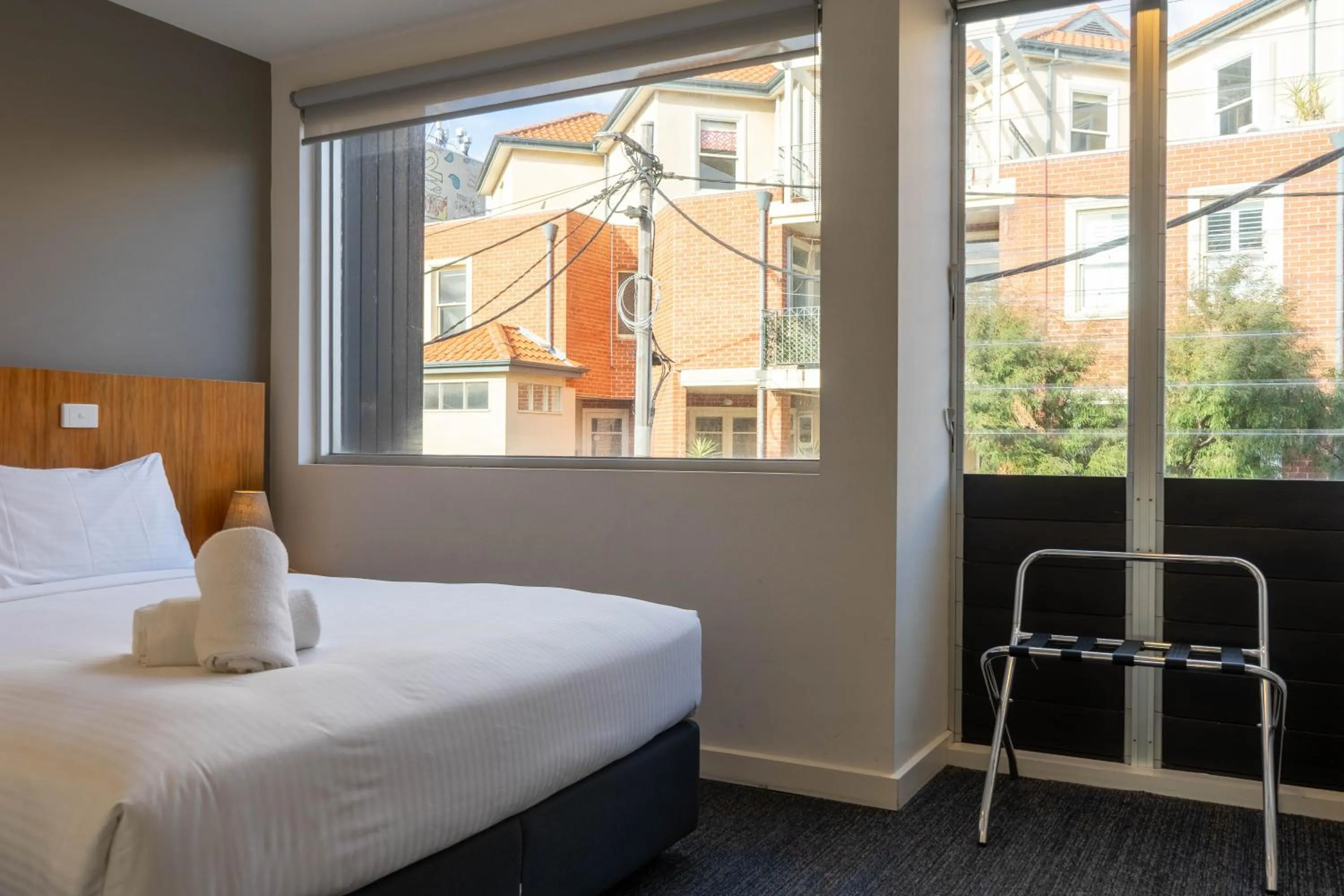 Bed in Cosmopolitan Hotel and Apartments