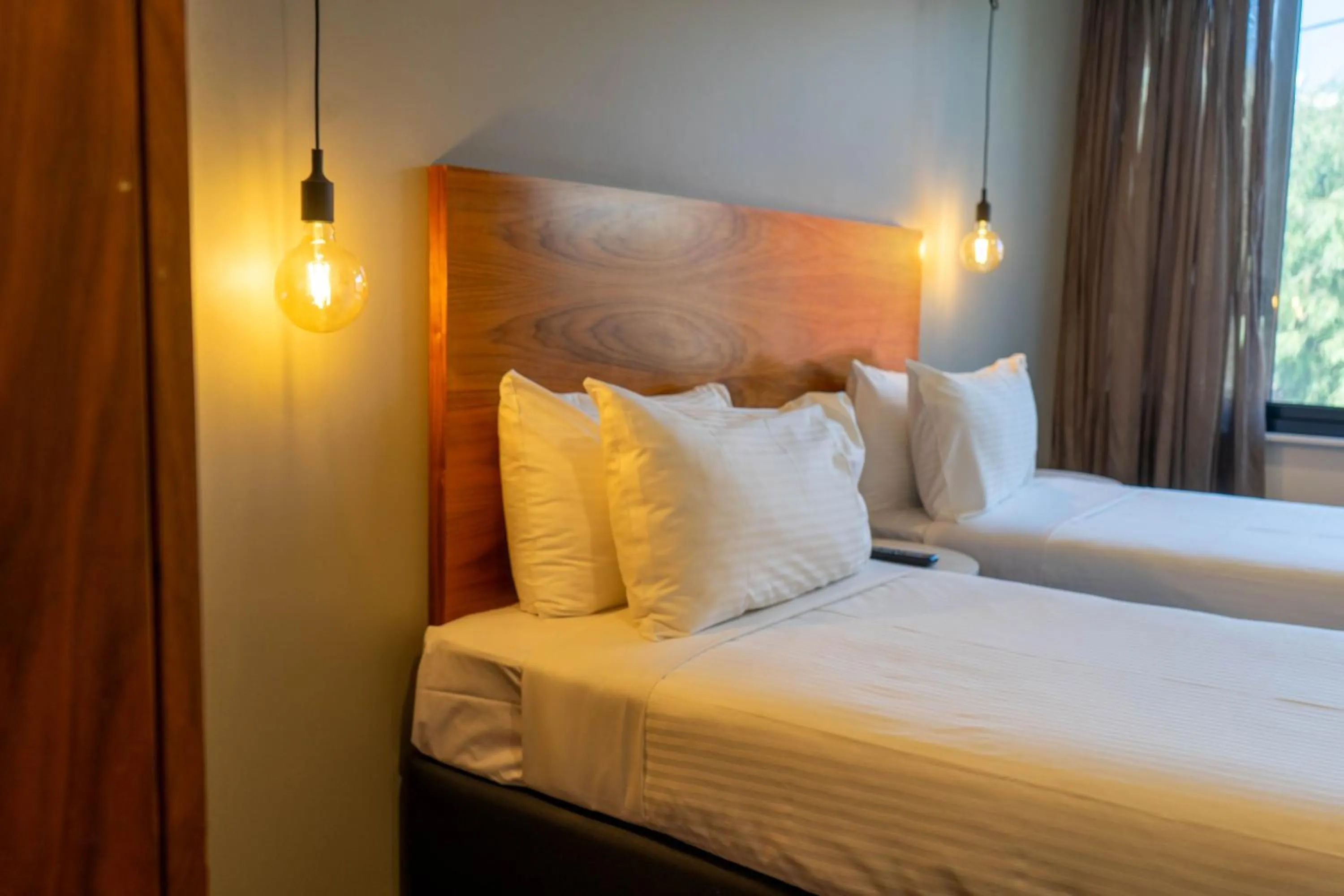 Bed in Cosmopolitan Hotel and Apartments