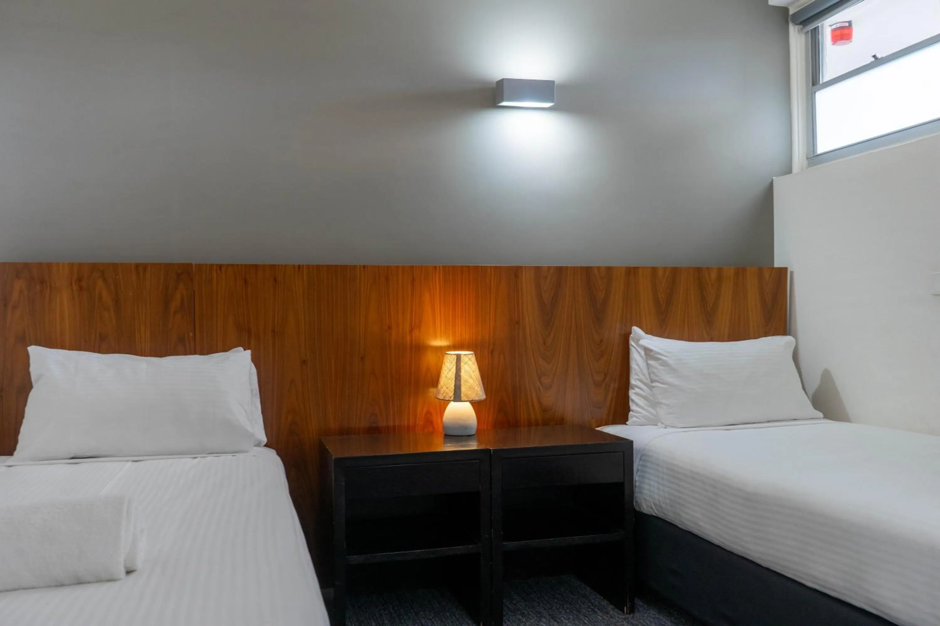 Bed in Cosmopolitan Hotel and Apartments