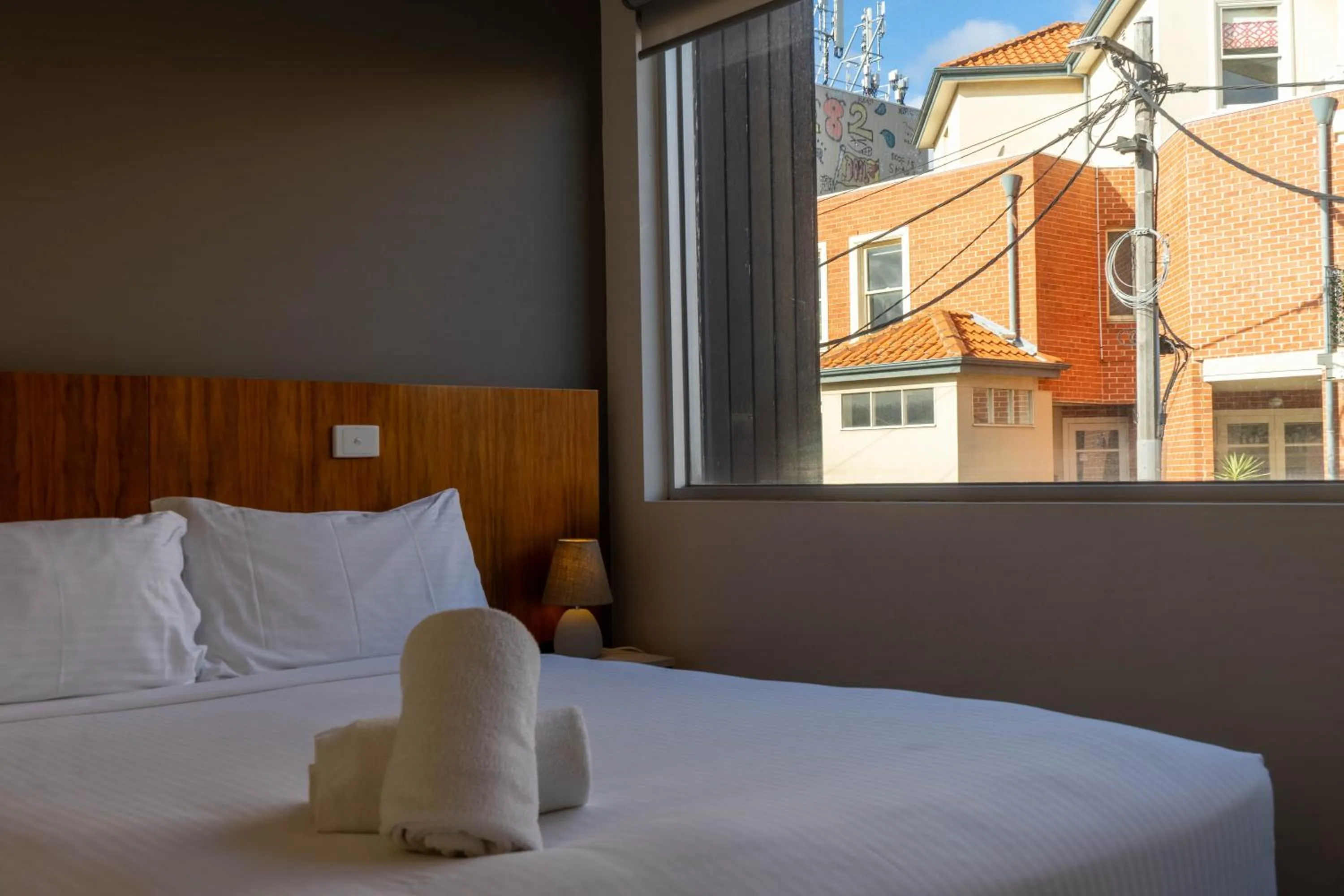 Bed in Cosmopolitan Hotel and Apartments