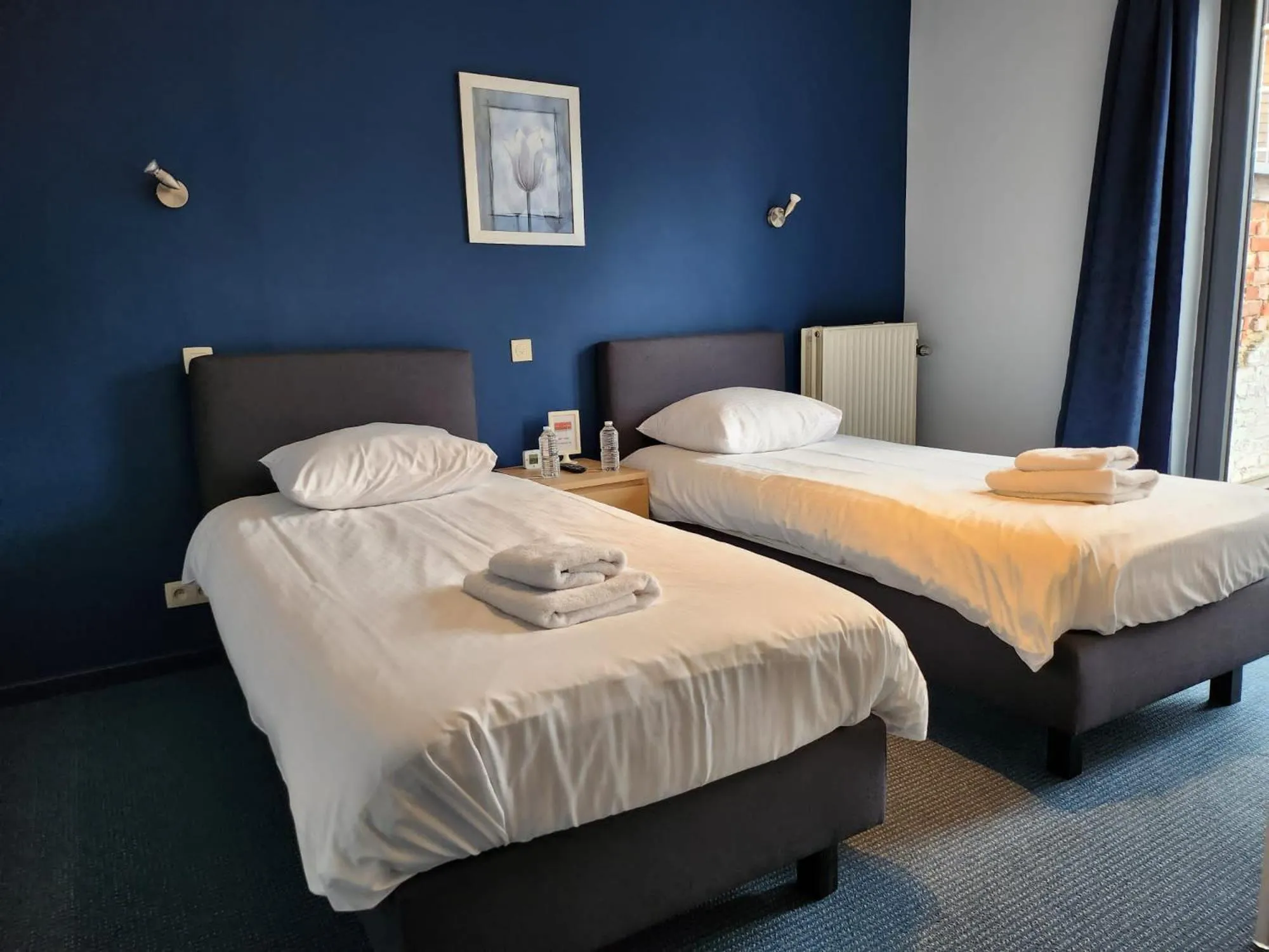 Bed in Hôtel Francorchamps Pitlane Lodge