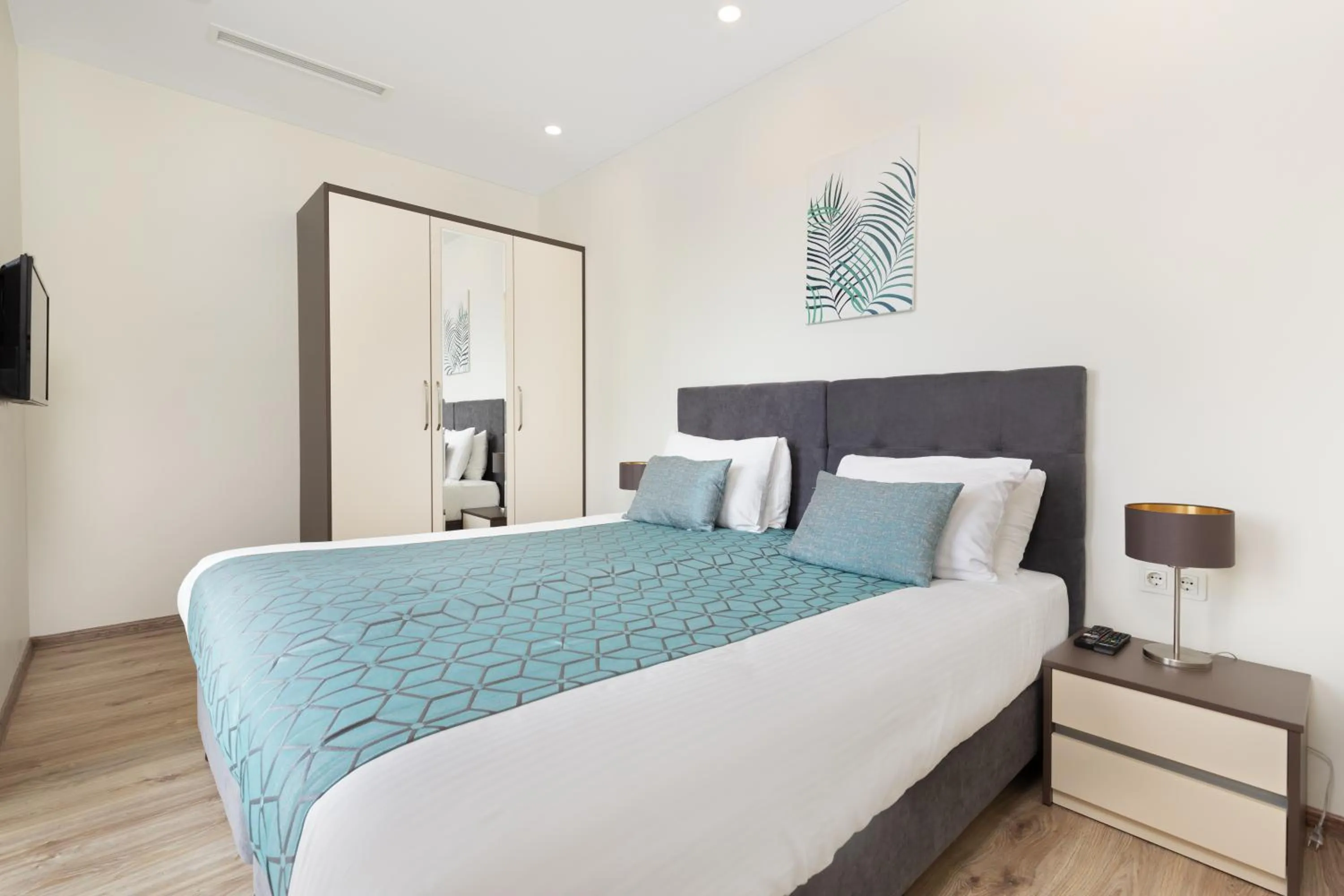 Bed in Bellevue Residence Suites