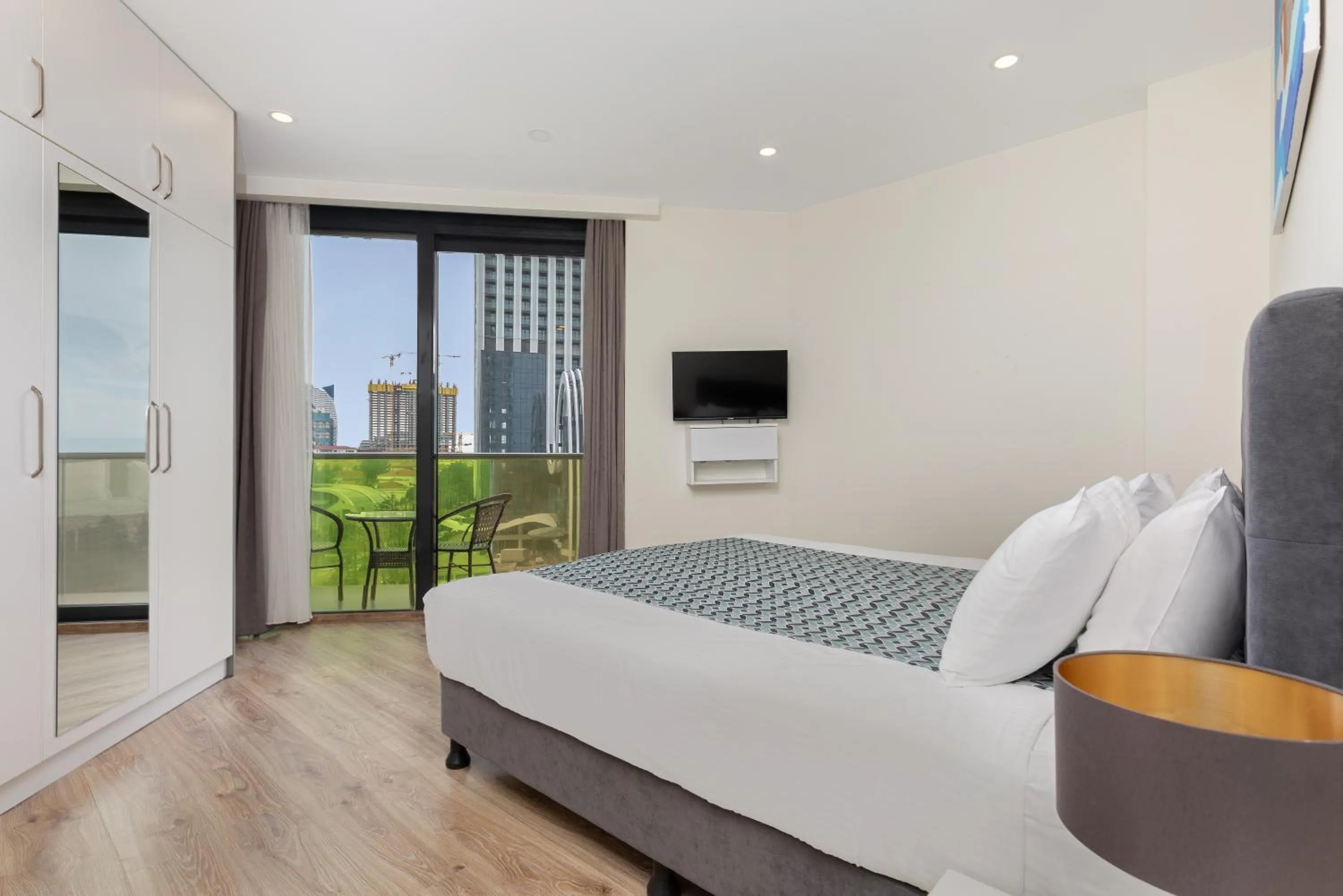 Bed in Bellevue Residence Suites