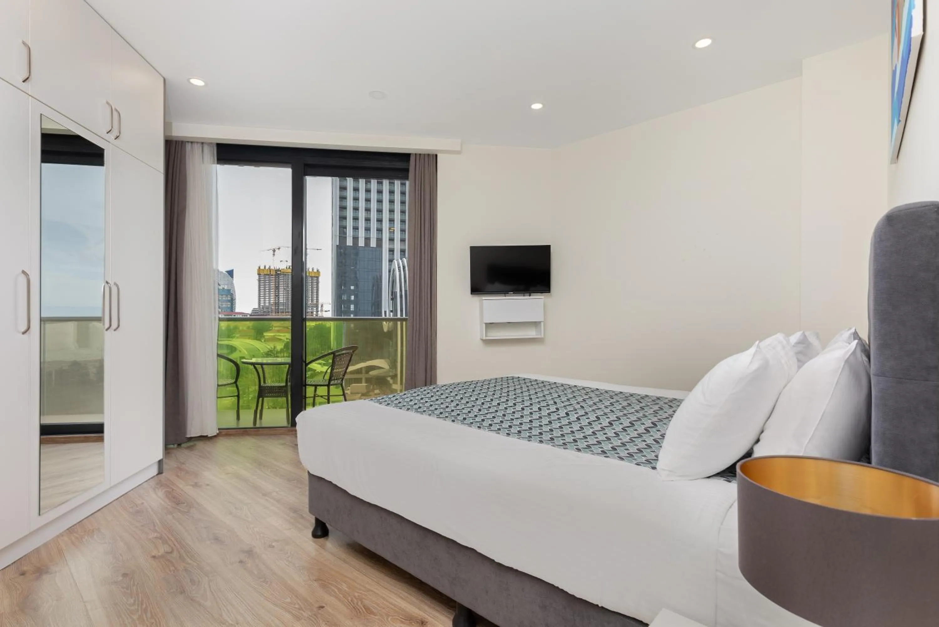 Bed in Bellevue Residence Suites