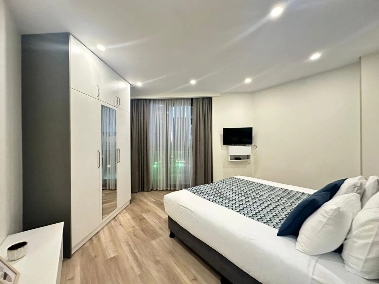 Bed in Bellevue Residence Suites