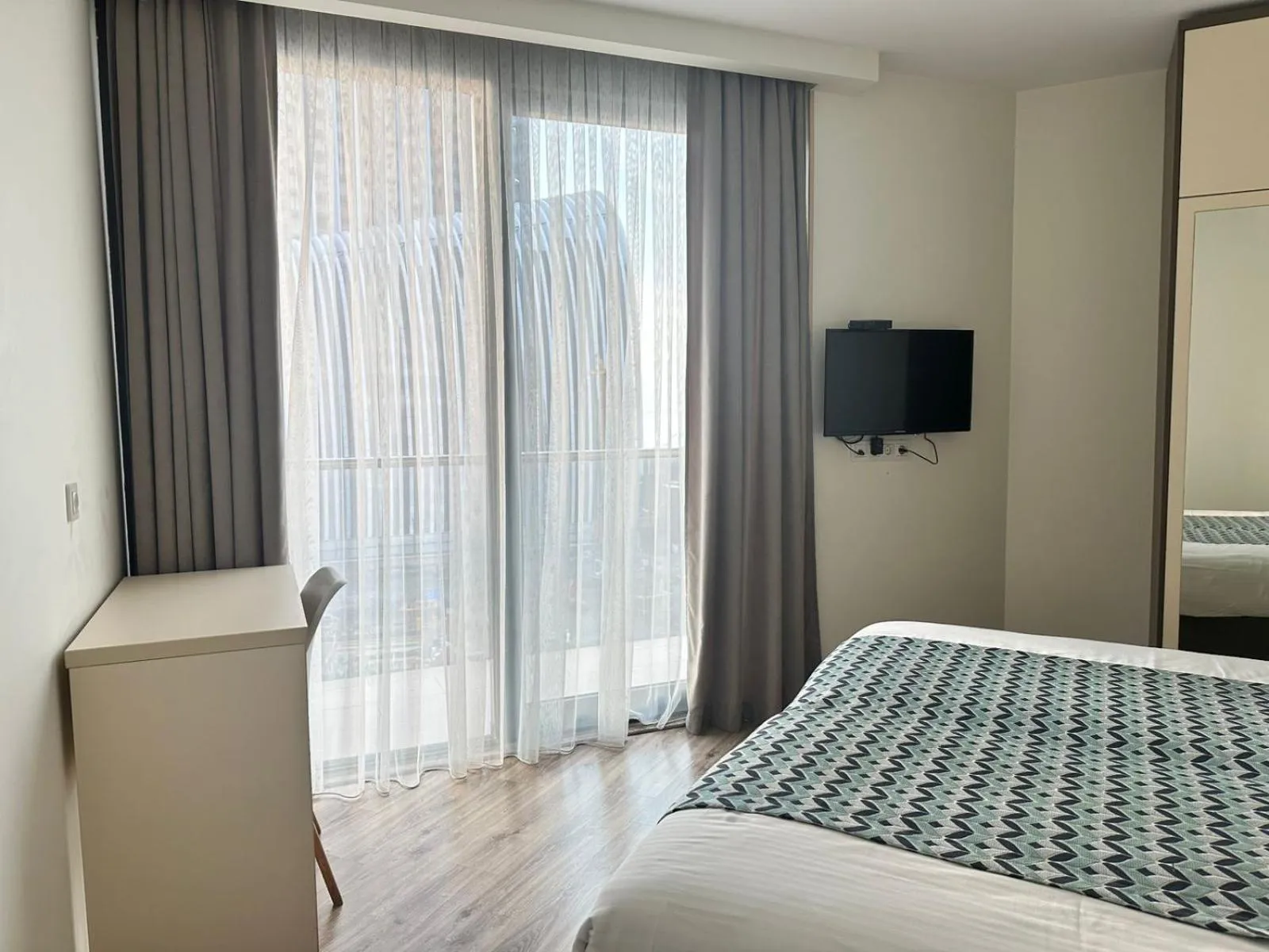 Bed in Bellevue Residence Suites