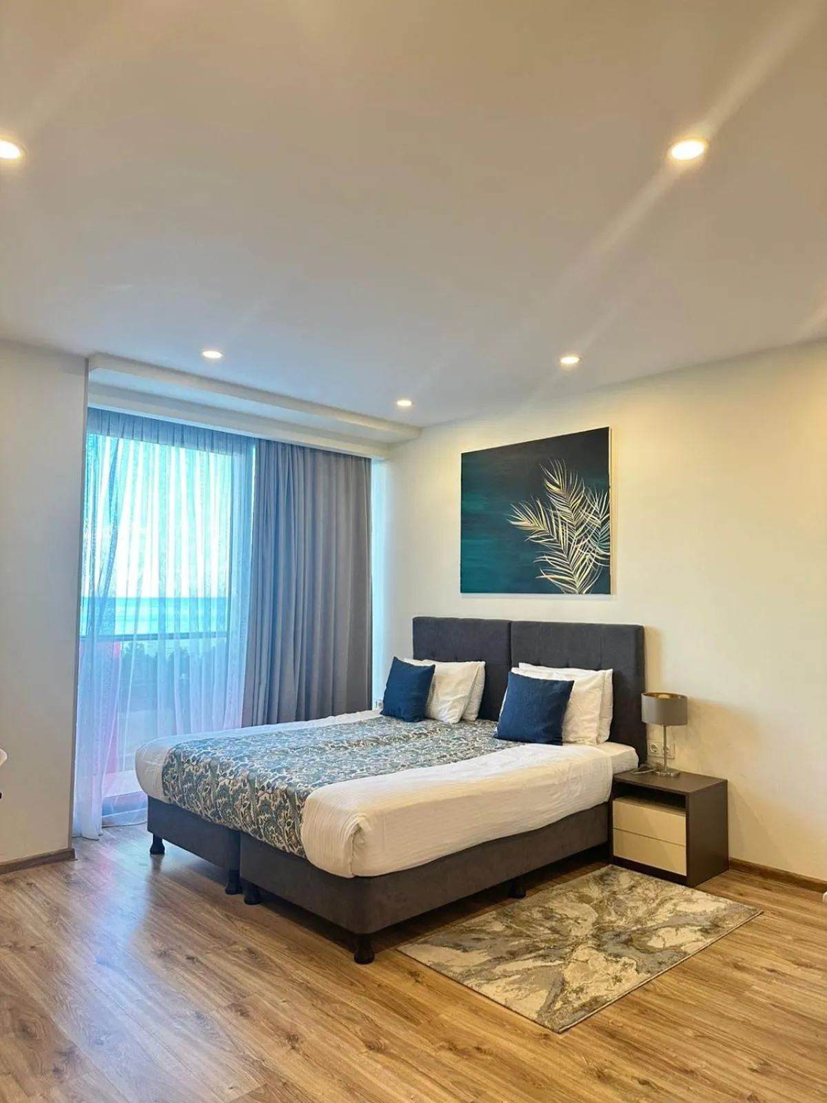 Bed in Bellevue Residence Suites