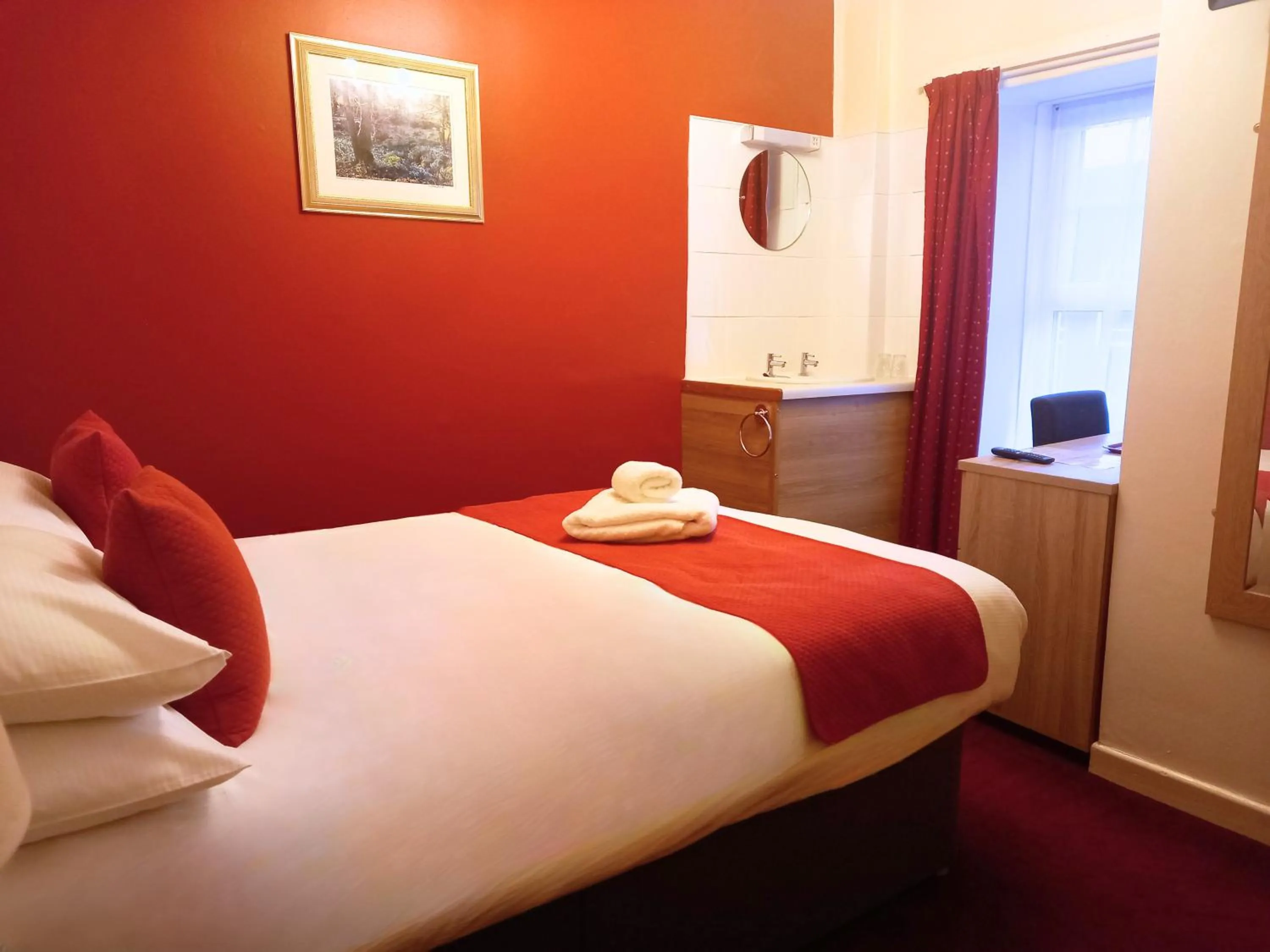 Bed in Royal Sportsman Hotel