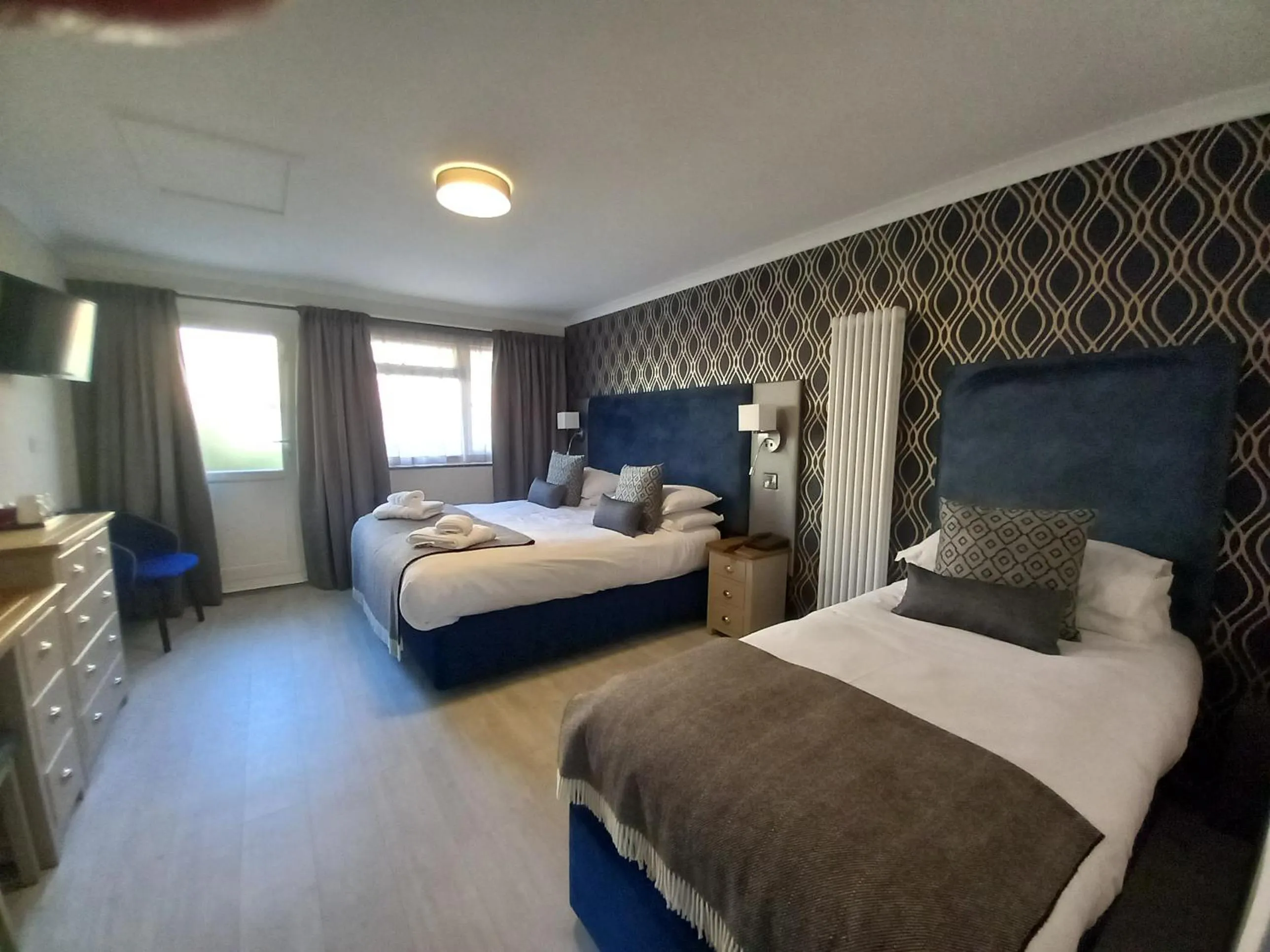 Bed in Royal Sportsman Hotel