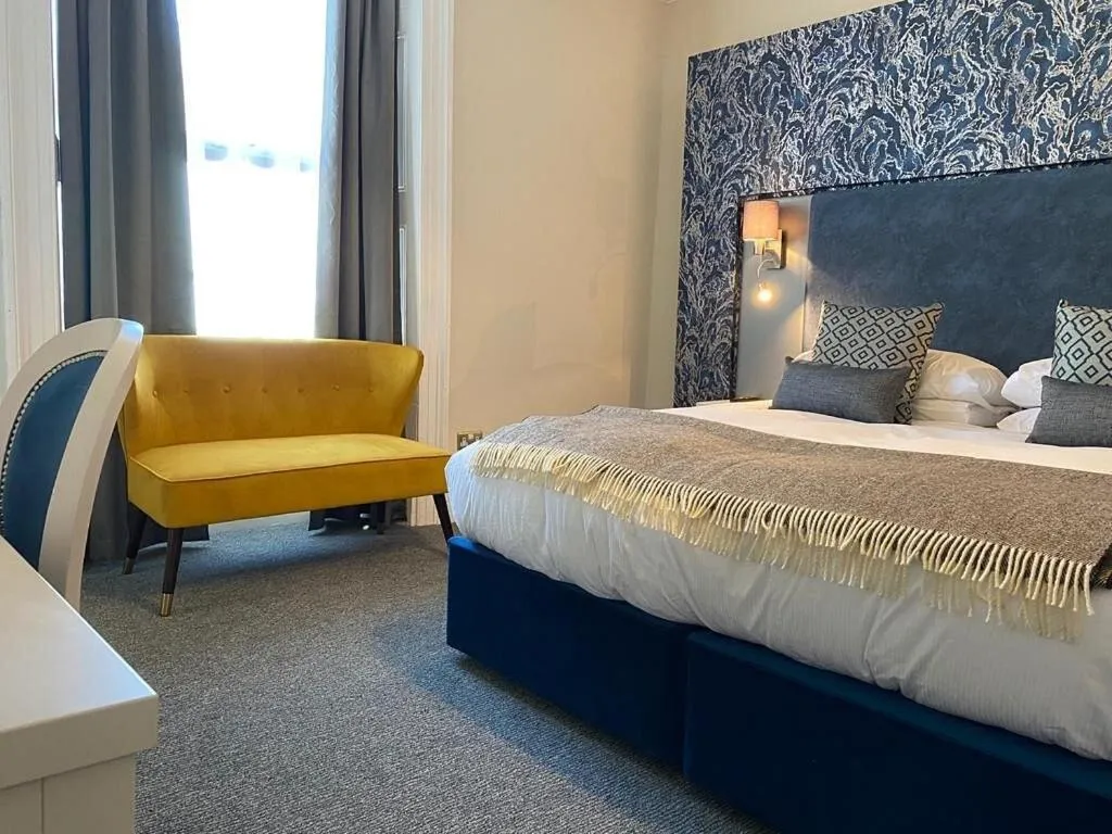 Bed in Royal Sportsman Hotel