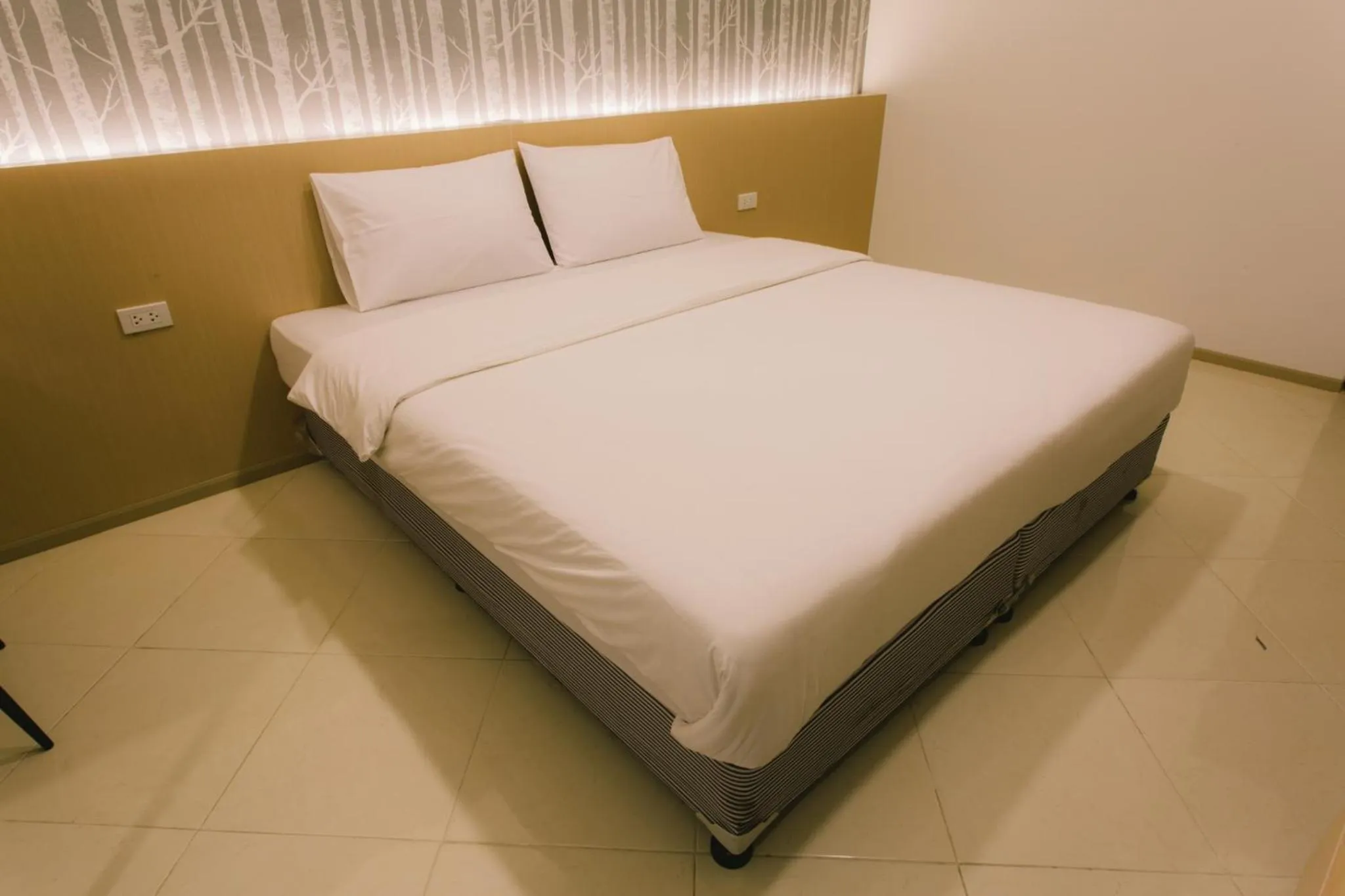 Bed in Royal Princess City Lamphun Hotel