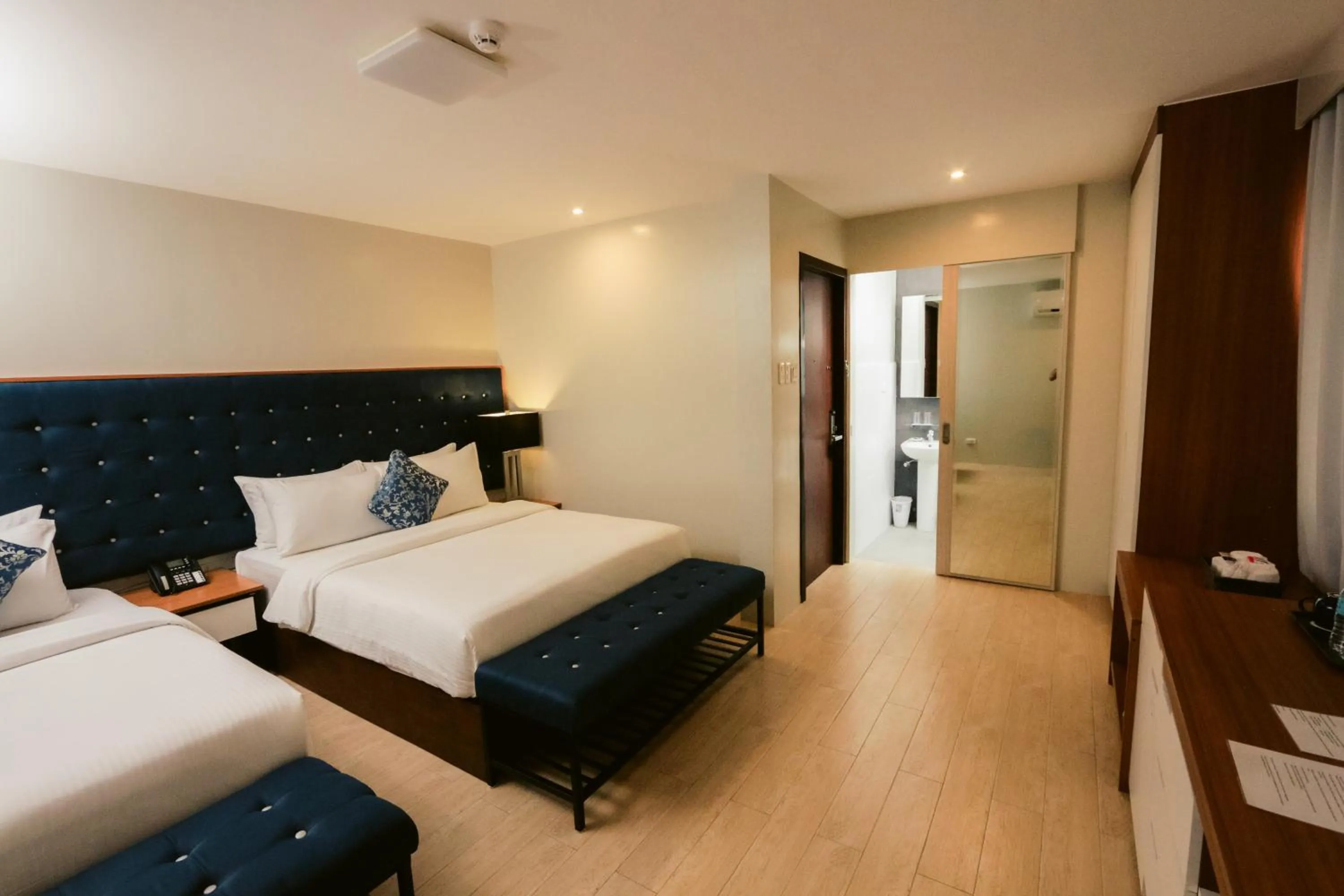 Bed in The Madeline Boutique Hotel & Suites