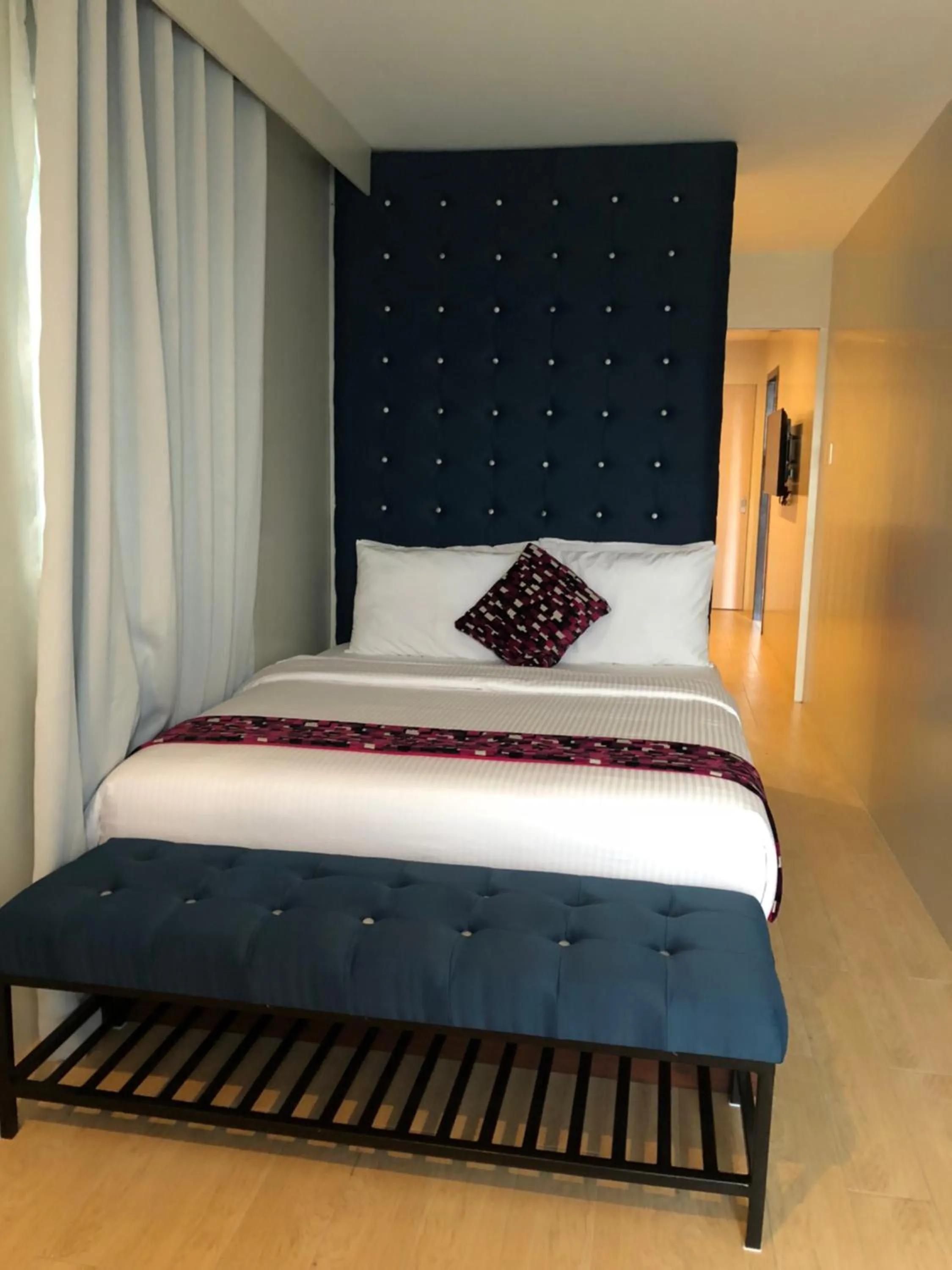 Bed in The Madeline Boutique Hotel & Suites