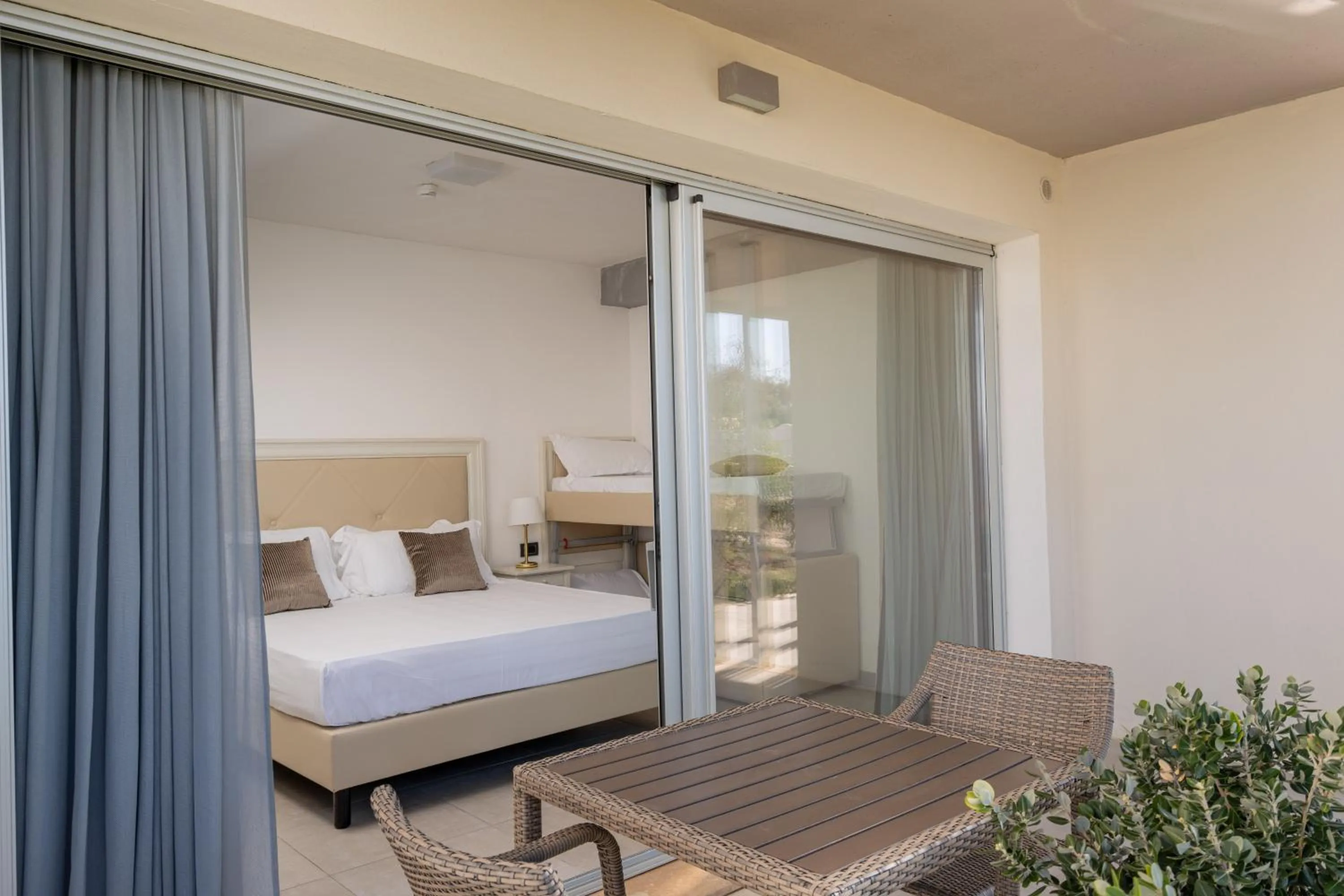 Balcony/Terrace, Bed in Bellevue Sardinia Resort Affiliated by Meliá