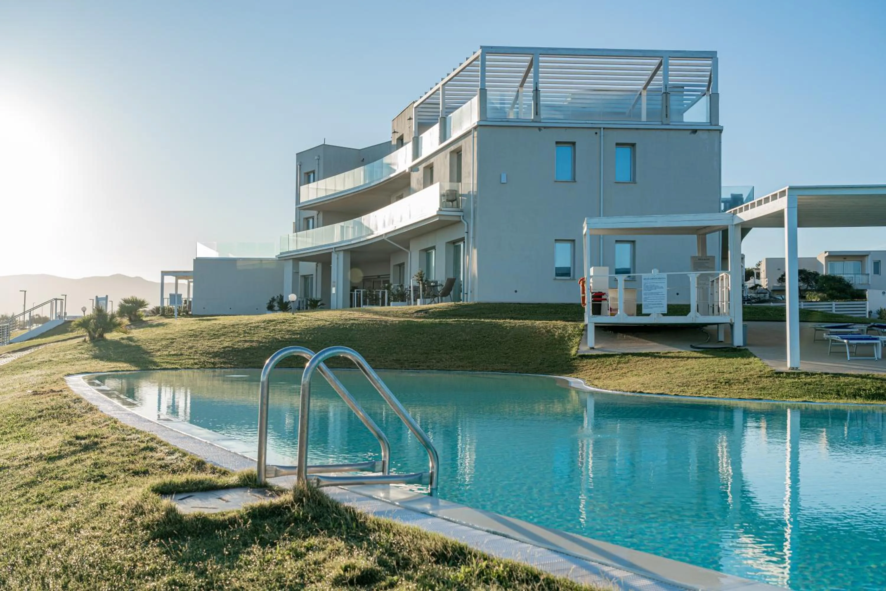 Swimming pool in Bellevue Sardinia Resort Affiliated by Meliá