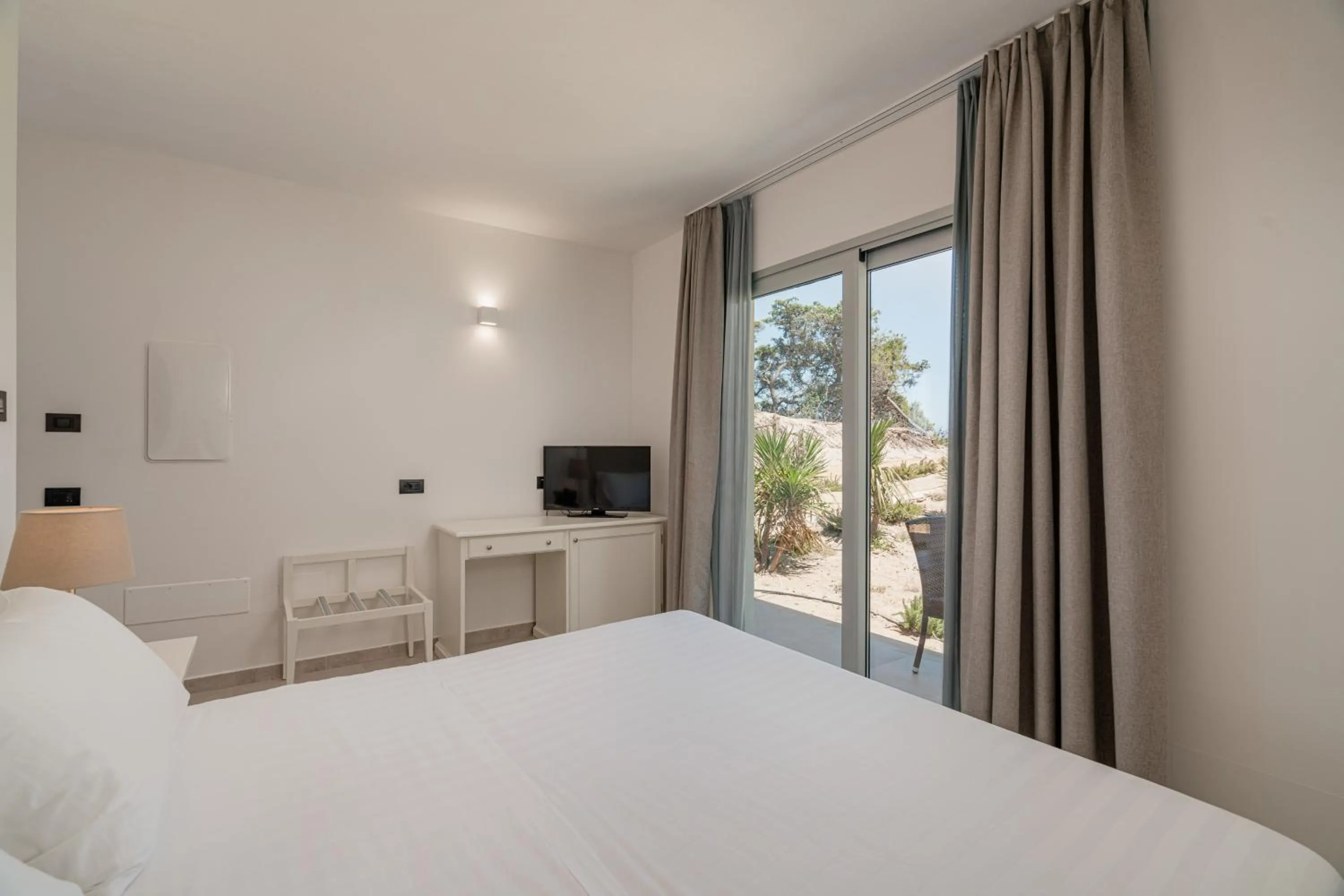 Bed in Bellevue Sardinia Resort Affiliated by Meliá