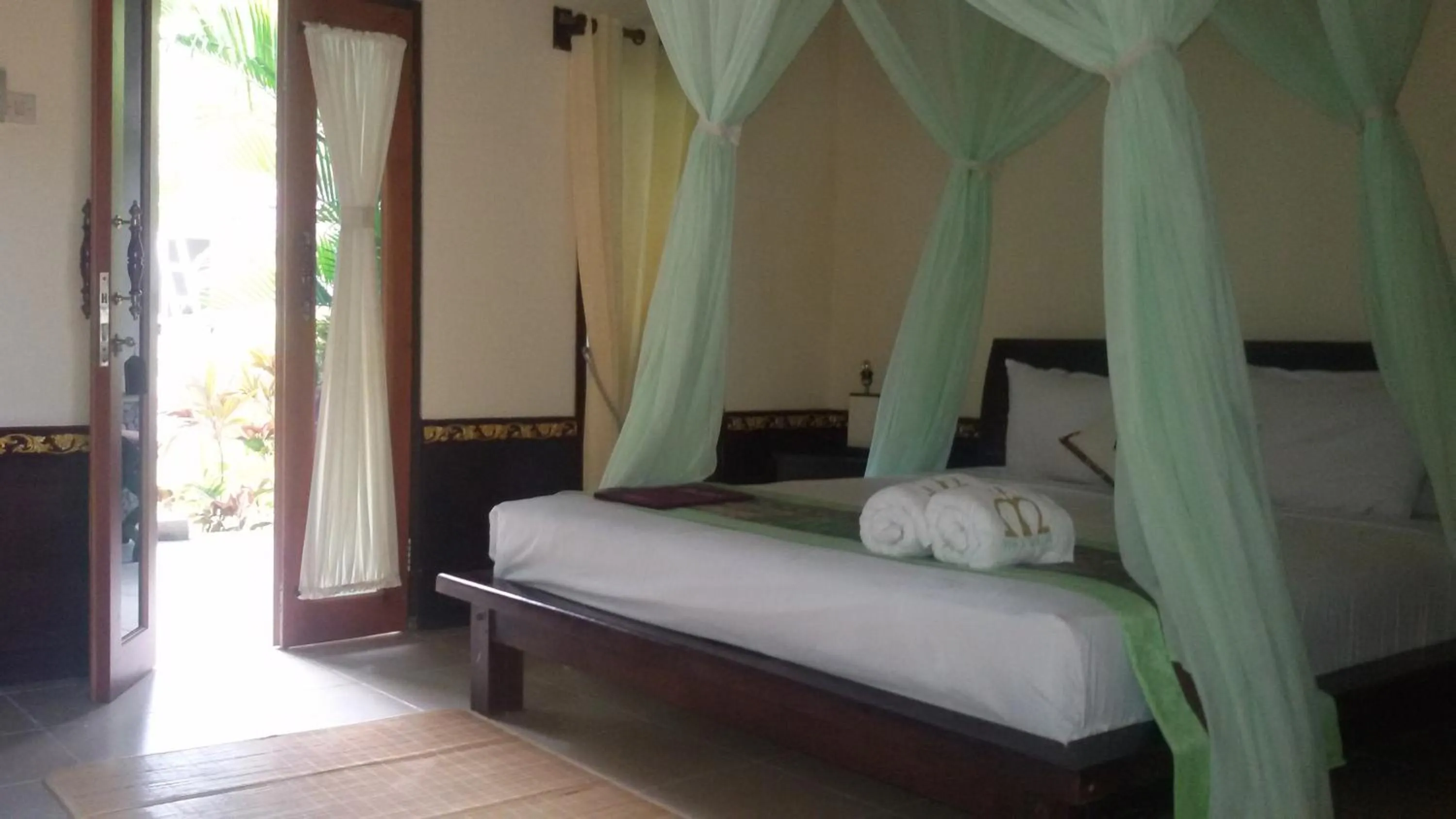 Bed in Mans Cottages & Spa